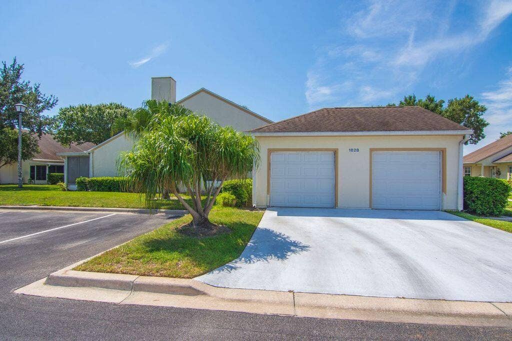 1828 AYNSLEY Way, #1, Vero Beach, FL 32966 Attached Garage on the left, enters to kitchen