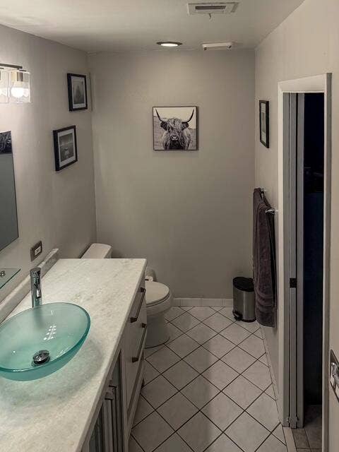 924 CUMBERLAND Terrace, Davie, FL 33325 White tile flooring with dark grout, light-colored vanity with a vessel sink, wall-mounted lighting fixture, and recessed ceiling lights
