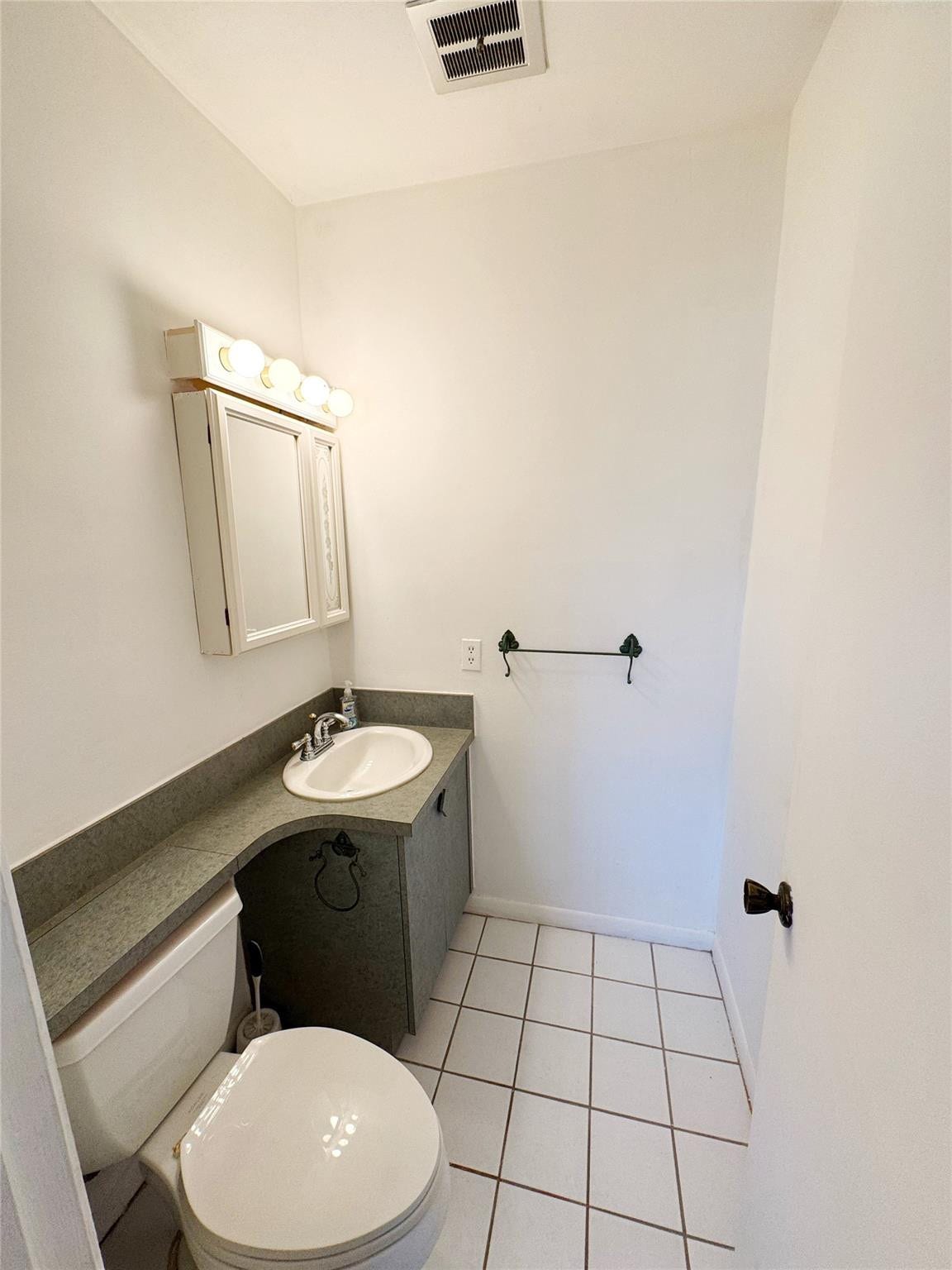 310 S CYPRESS Road, #729, Pompano Beach, FL 33060 Half bathroom loctaed inside the master bedroom
