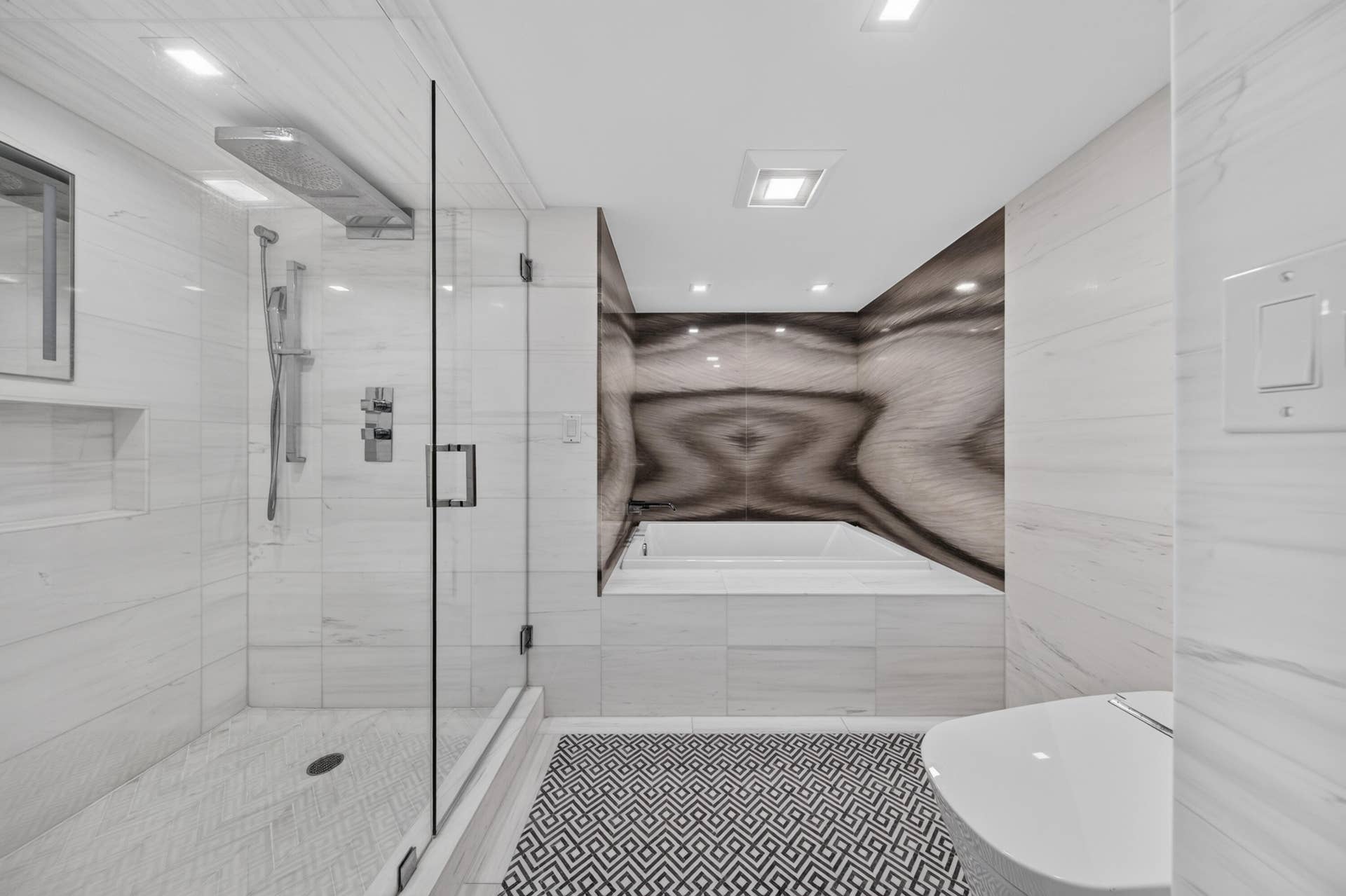 3900 Galt Ocean Drive, #2417, Fort Lauderdale, FL 33308 Relax in the deep soaking tub surrounded by dramatic book-matched stone-look walls and refined fixtures.