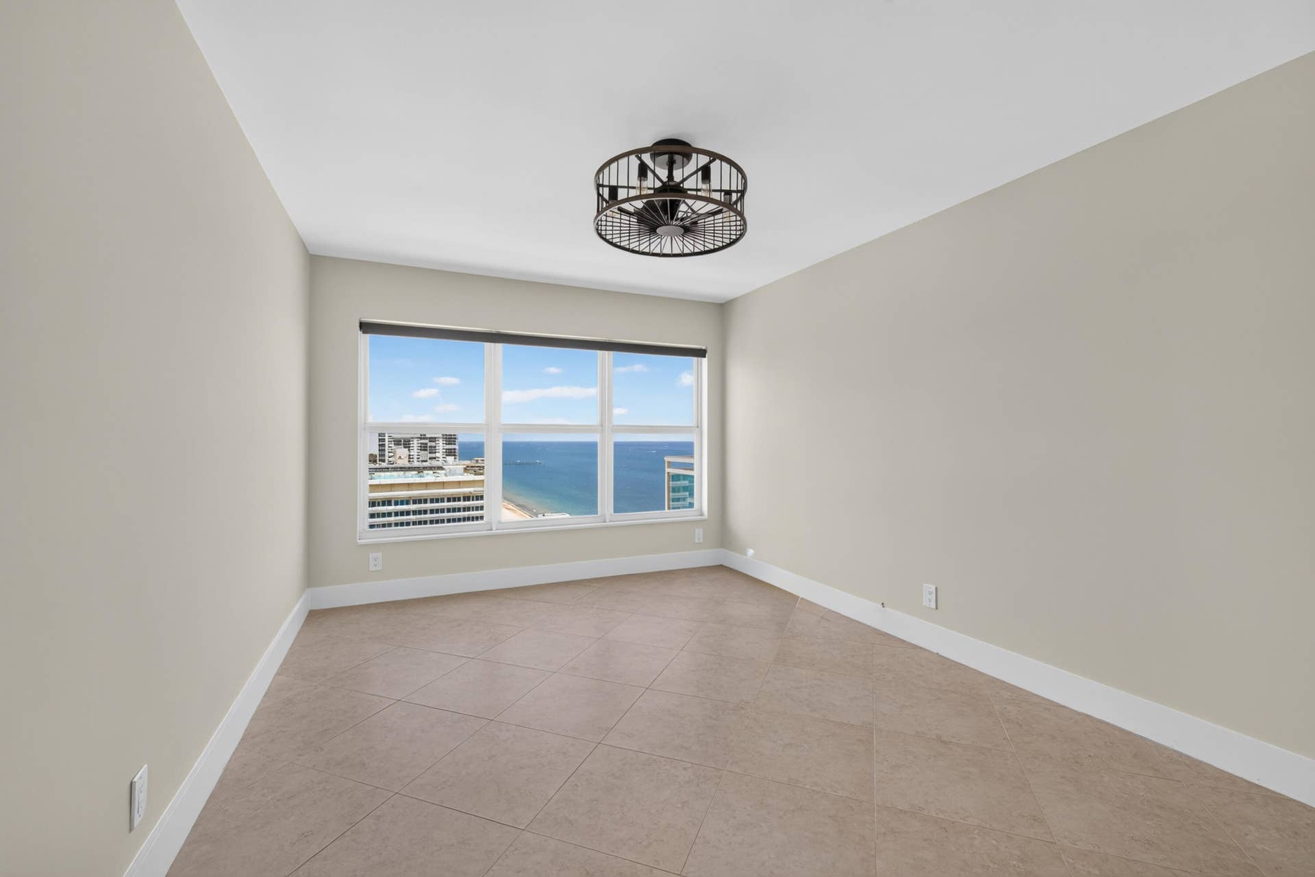 3900 Galt Ocean Drive, #2417, Fort Lauderdale, FL 33308 Spacious guest bedroom with tile flooring and beautiful views of the Atlantic Ocean.