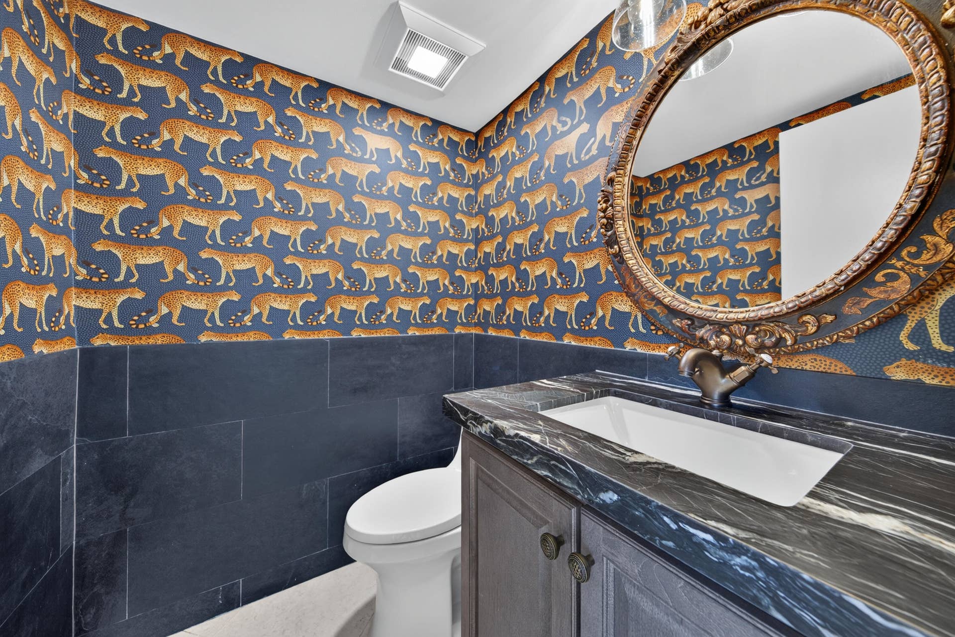 3900 Galt Ocean Drive, #2417, Fort Lauderdale, FL 33308 Distinctive powder room featuring dramatic designer wallcovering, stone surfaces and an elegant statement mirror.