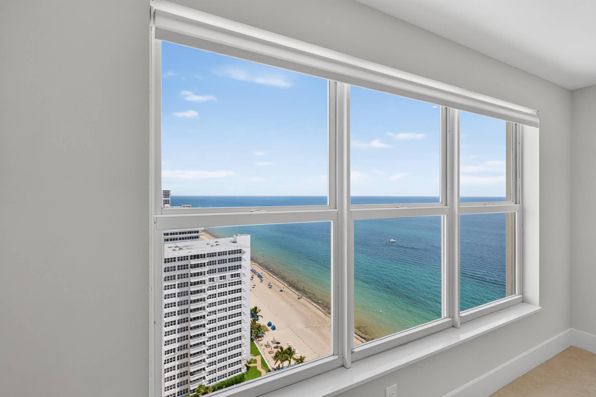 3900 Galt Ocean Drive, #2417, Fort Lauderdale, FL 33308 Upgraded high-impact windows frame sweeping ocean and coastline views from the guest bedroom.