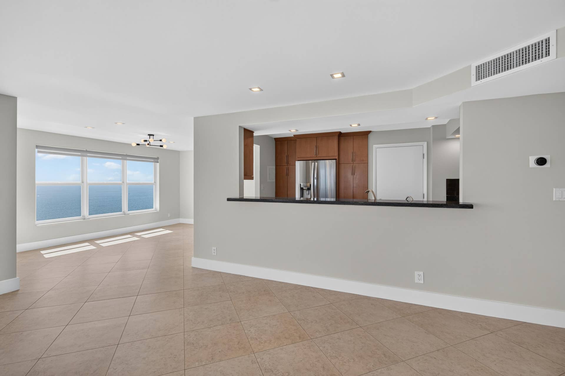 3900 Galt Ocean Drive, #2417, Fort Lauderdale, FL 33308 The open kitchen connects effortlessly with the dining and living spaces for relaxed coastal entertaining.