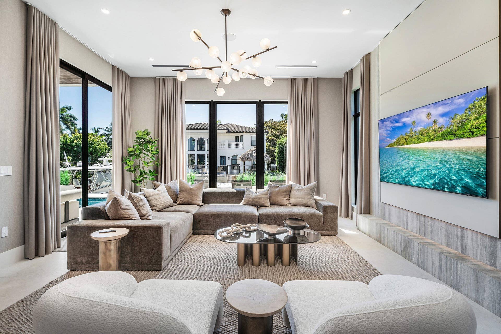 Built-in media console with integrated television, backlighting, and flush cabinetry