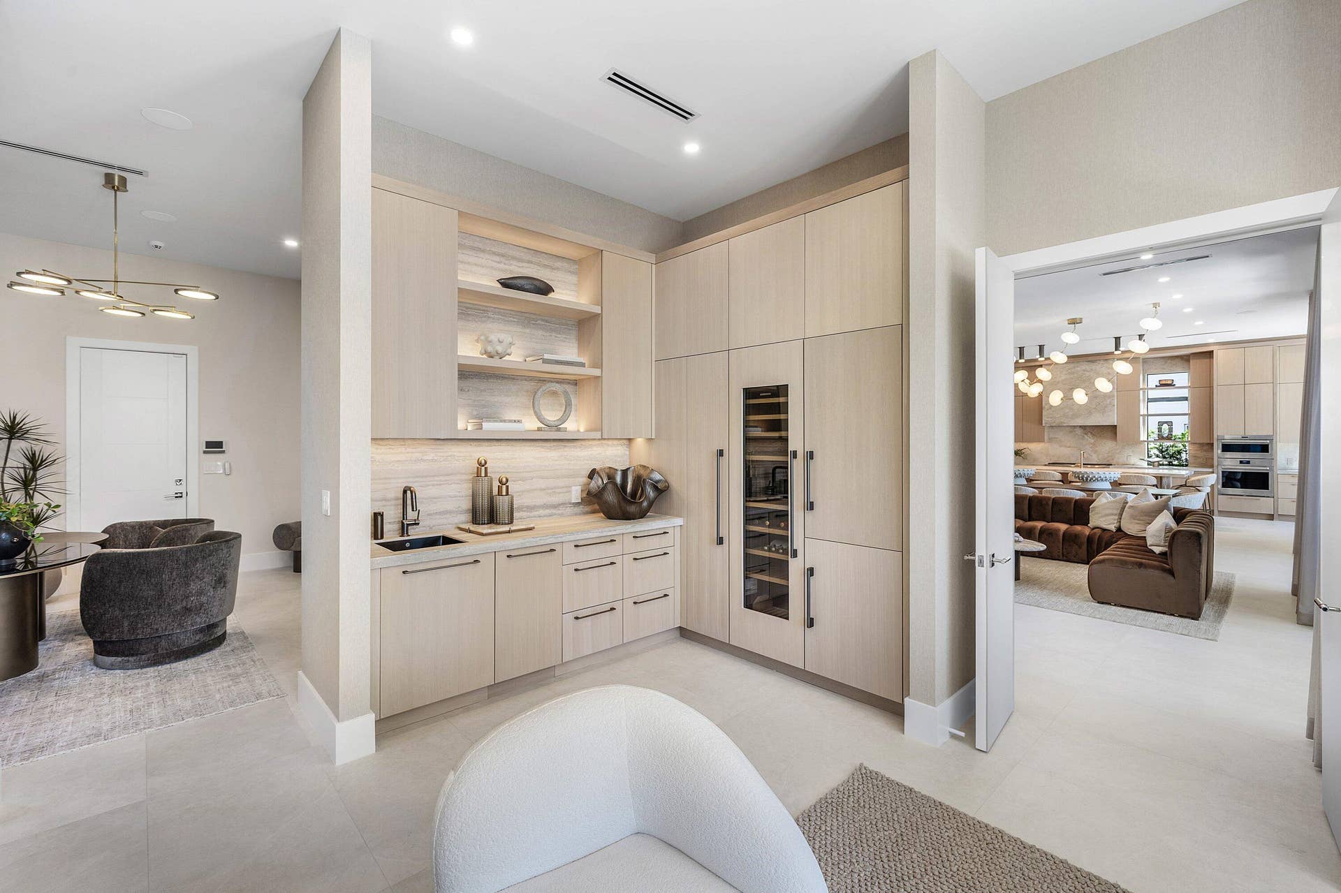 Natural wood cabinetry with Liebherr Refrigerator, Freezer, 80-Bottle Wine Storage and Miele Dishwasher