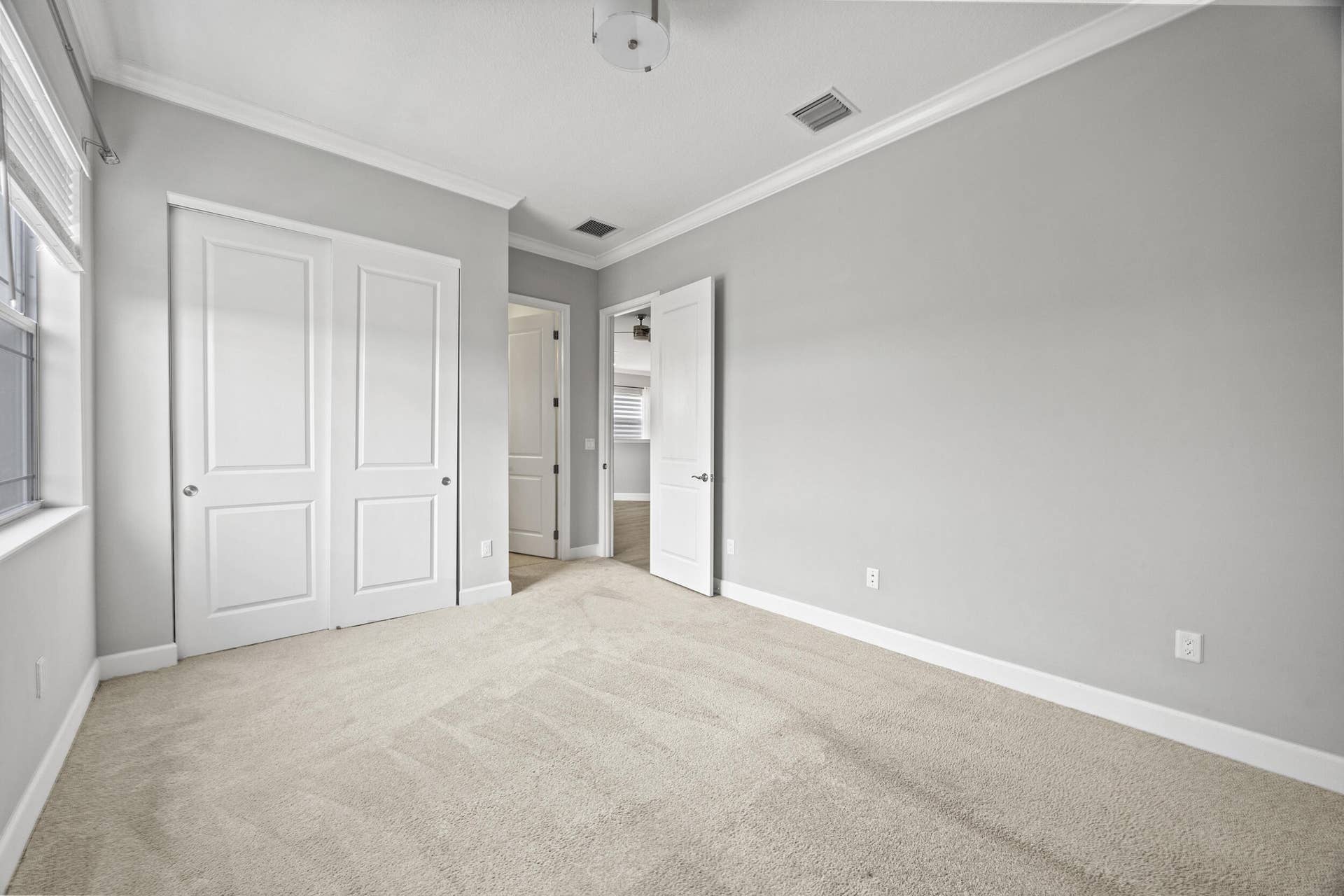 16007 Whippoorwill Circle, Westlake, Westlake, FL 33470 Plush carpeting, crisp white trim, crown molding, and bi-fold closet doors