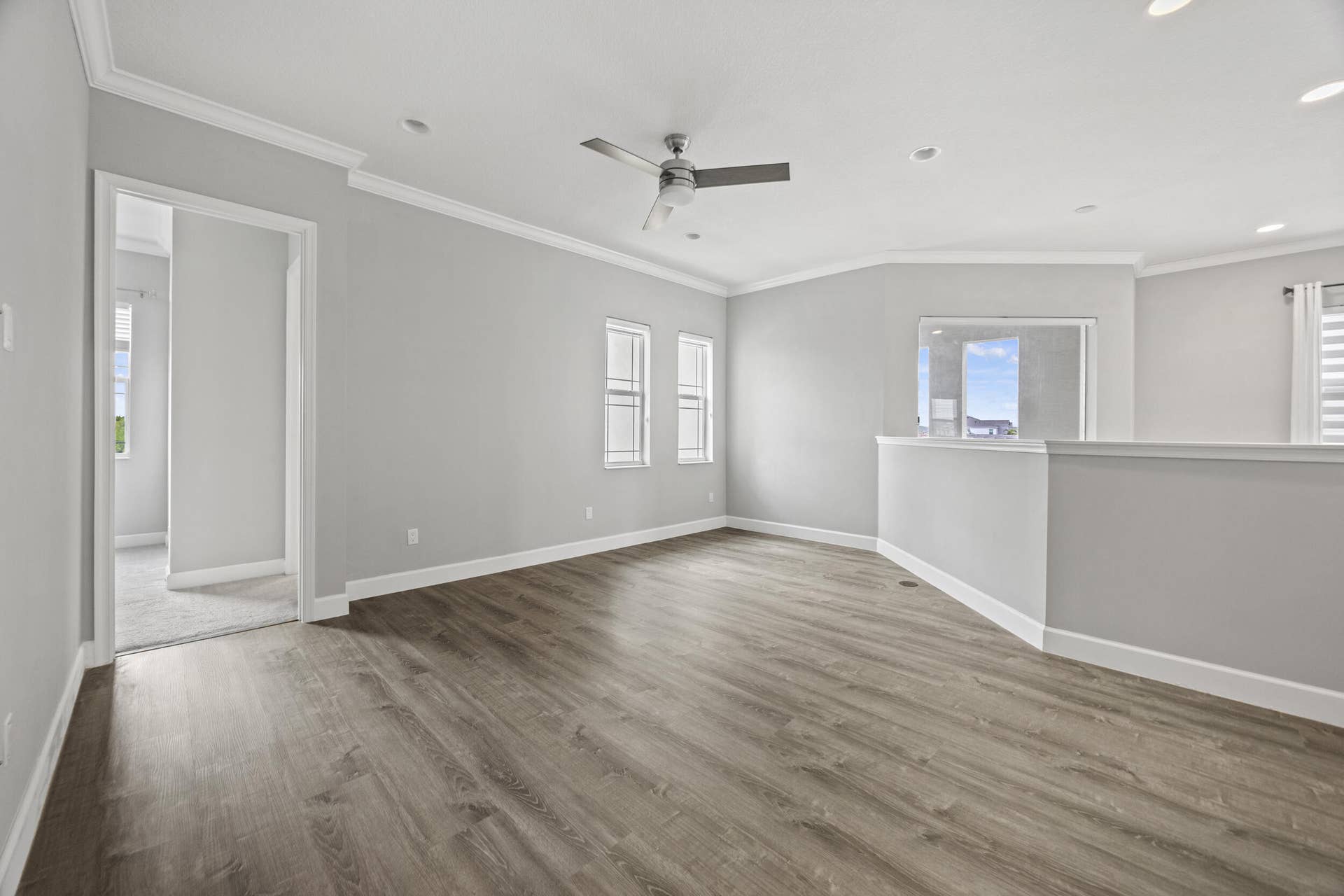 16007 Whippoorwill Circle, Westlake, Westlake, FL 33470 Spacious room featuring wood-finish flooring, recessed lighting, and a ceiling fan