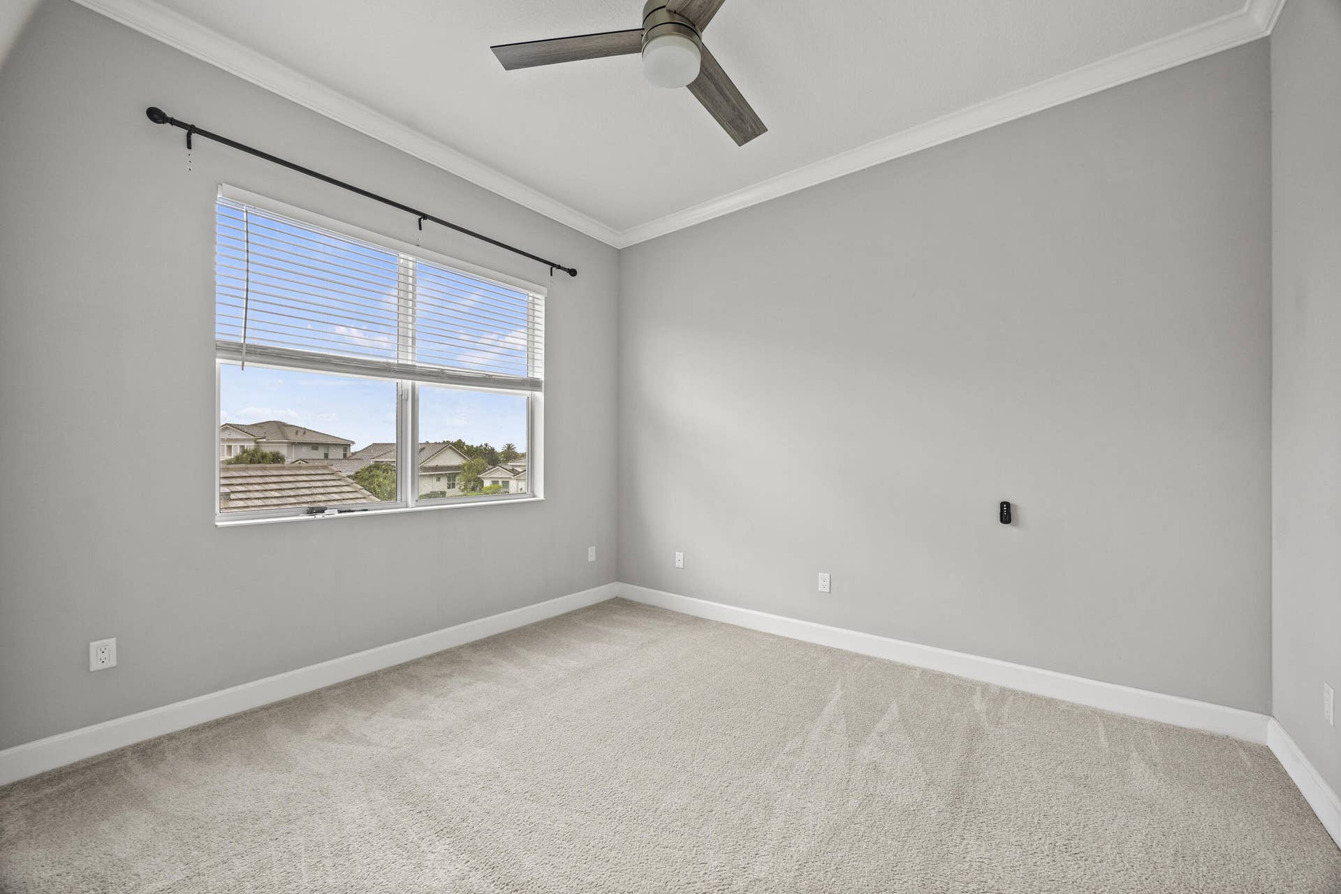 16007 Whippoorwill Circle, Westlake, Westlake, FL 33470 Wall-to-wall carpeting, crown molding, and a ceiling fan
