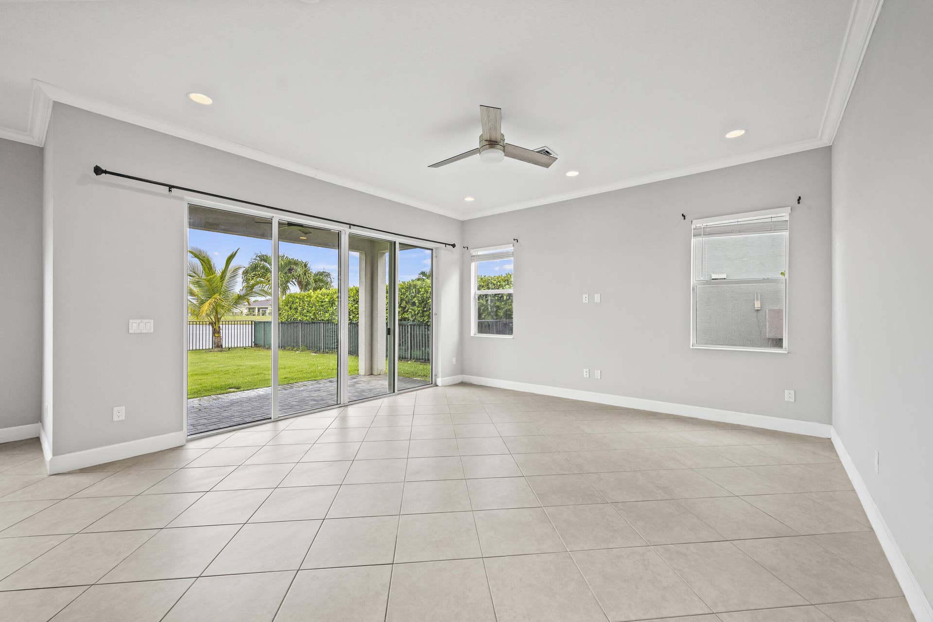 16007 Whippoorwill Circle, Westlake, Westlake, FL 33470 Spacious room with tile flooring, crown molding, recessed lighting, and a ceiling fan