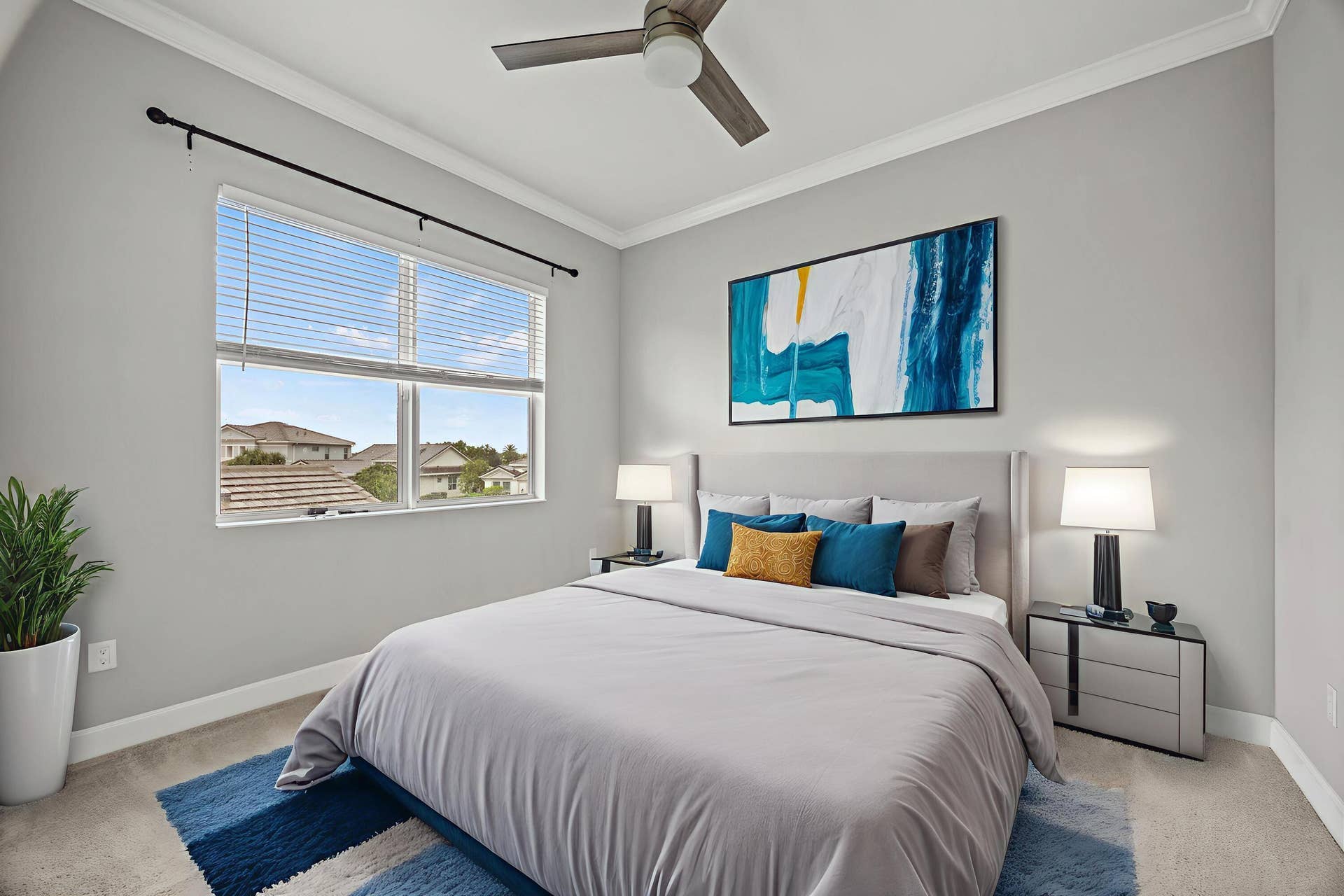 16007 Whippoorwill Circle, Westlake, Westlake, FL 33470 Ceiling fan with wooden-finish blades, crown molding, double window with blinds, and light gray wall paint