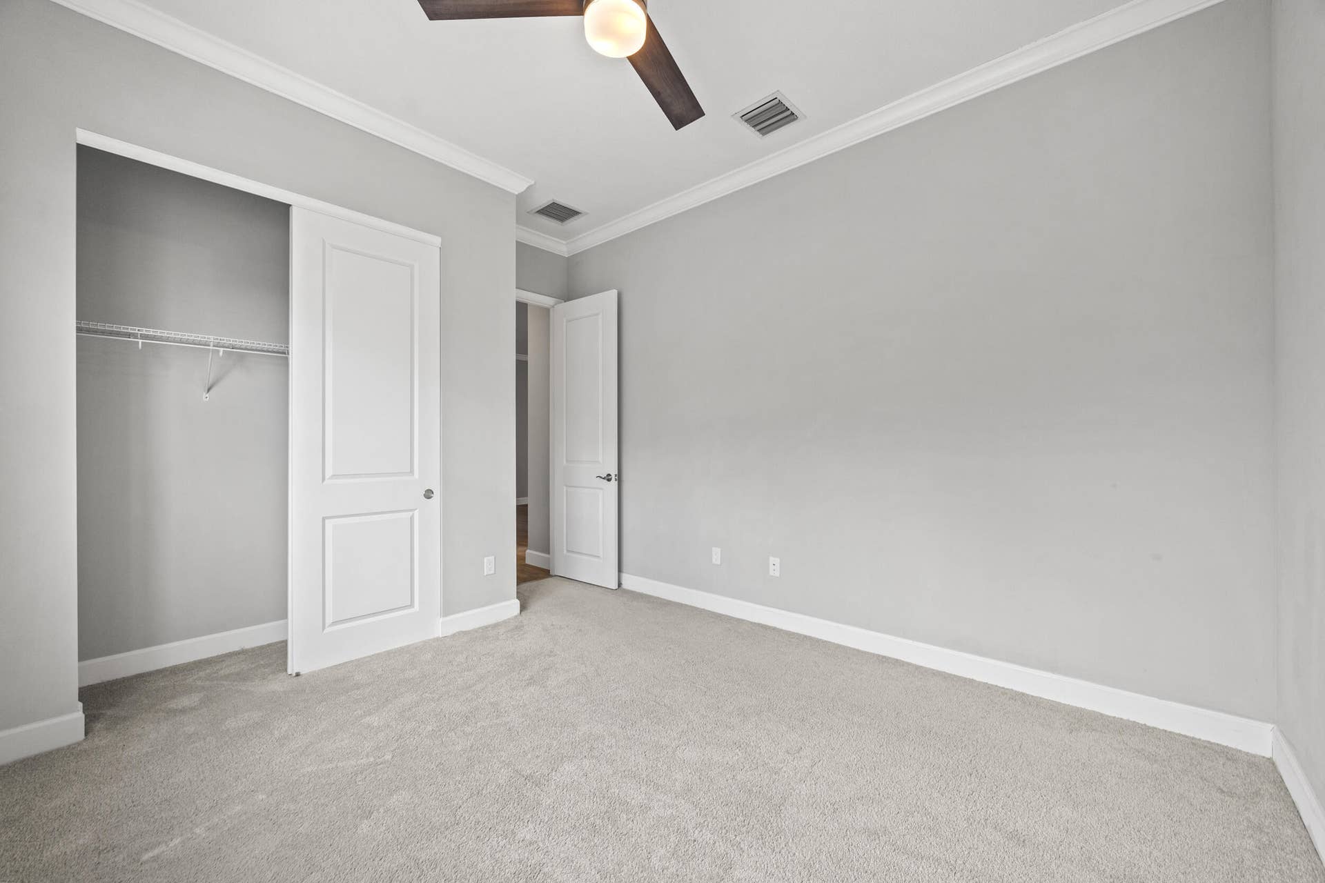 16007 Whippoorwill Circle, Westlake, Westlake, FL 33470 Carpeted flooring, crown molding, ceiling fan, and white doors