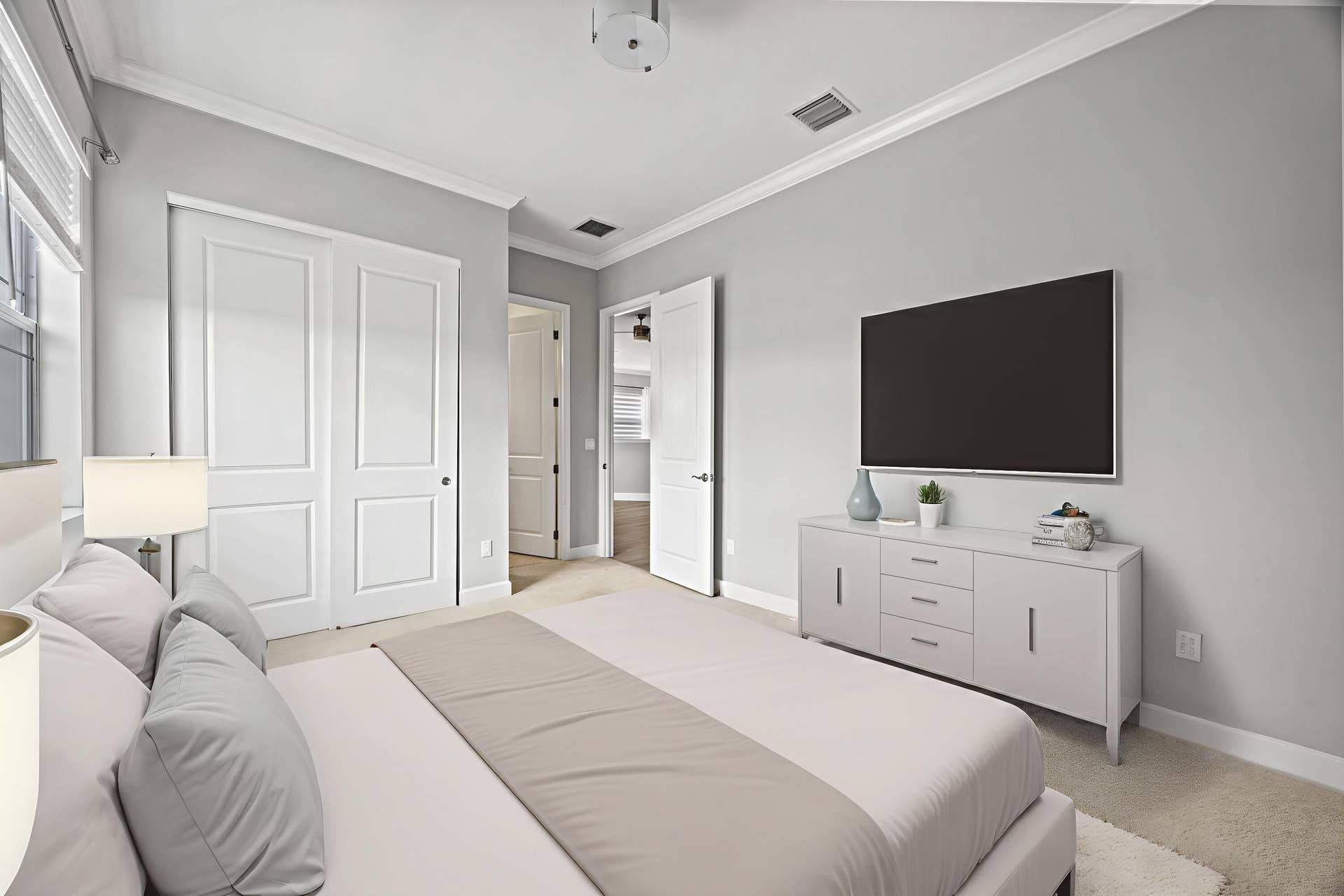 16007 Whippoorwill Circle, Westlake, Westlake, FL 33470 Recessed lighting, crown molding, double-panel closet doors, and light gray wall paint