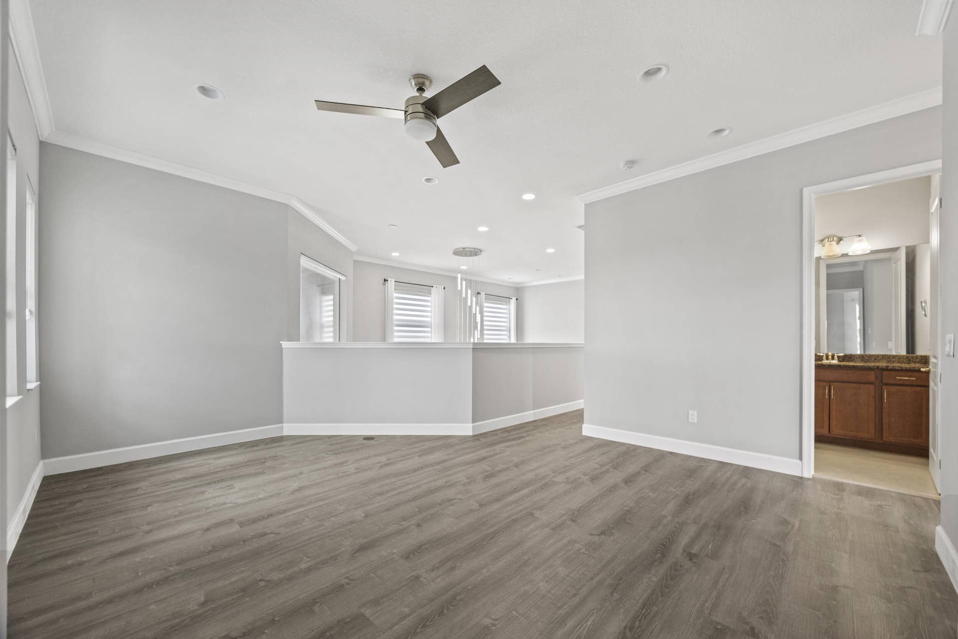 16007 Whippoorwill Circle, Westlake, Westlake, FL 33470 Recessed lighting, wood-finish flooring, ceiling fan, crown molding, and private bathroom access
