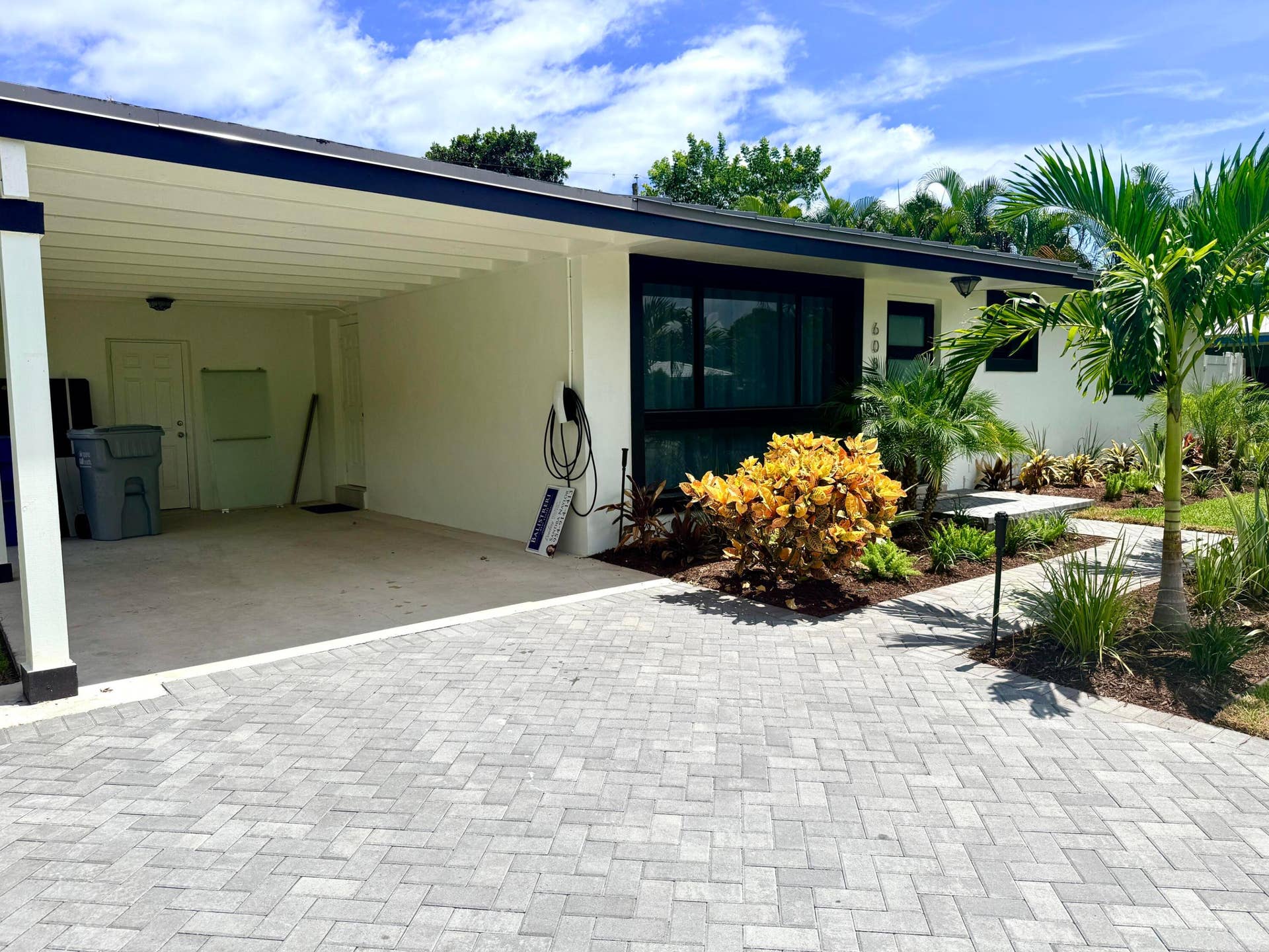 608 NE 24TH Avenue, Pompano Beach, Pompano Beach, FL 33062 Front of home with carport and EV Charger