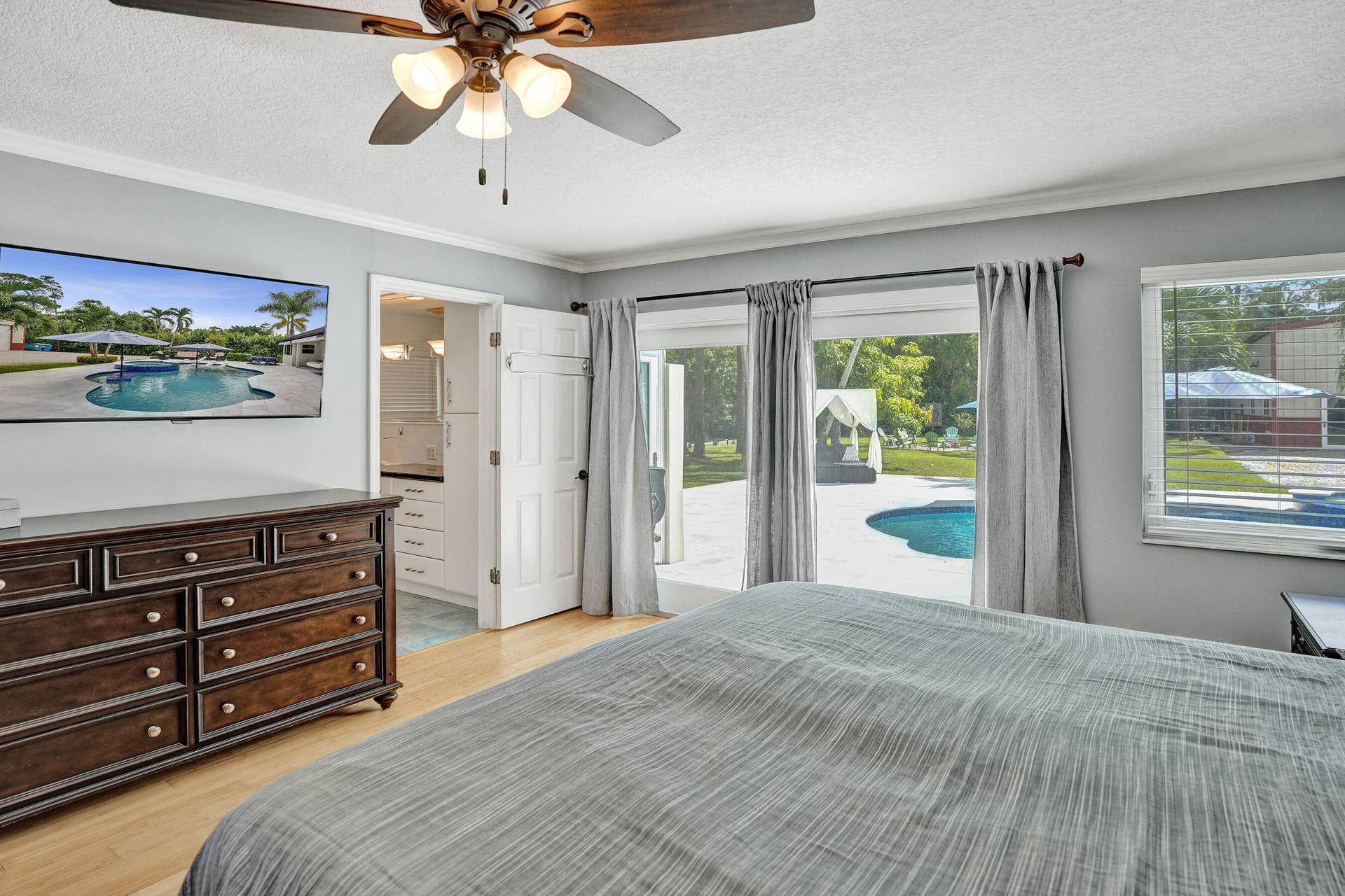 6146 NW 66TH Avenue, Parkland, FL 33067 Primary bedroom overlooking pool