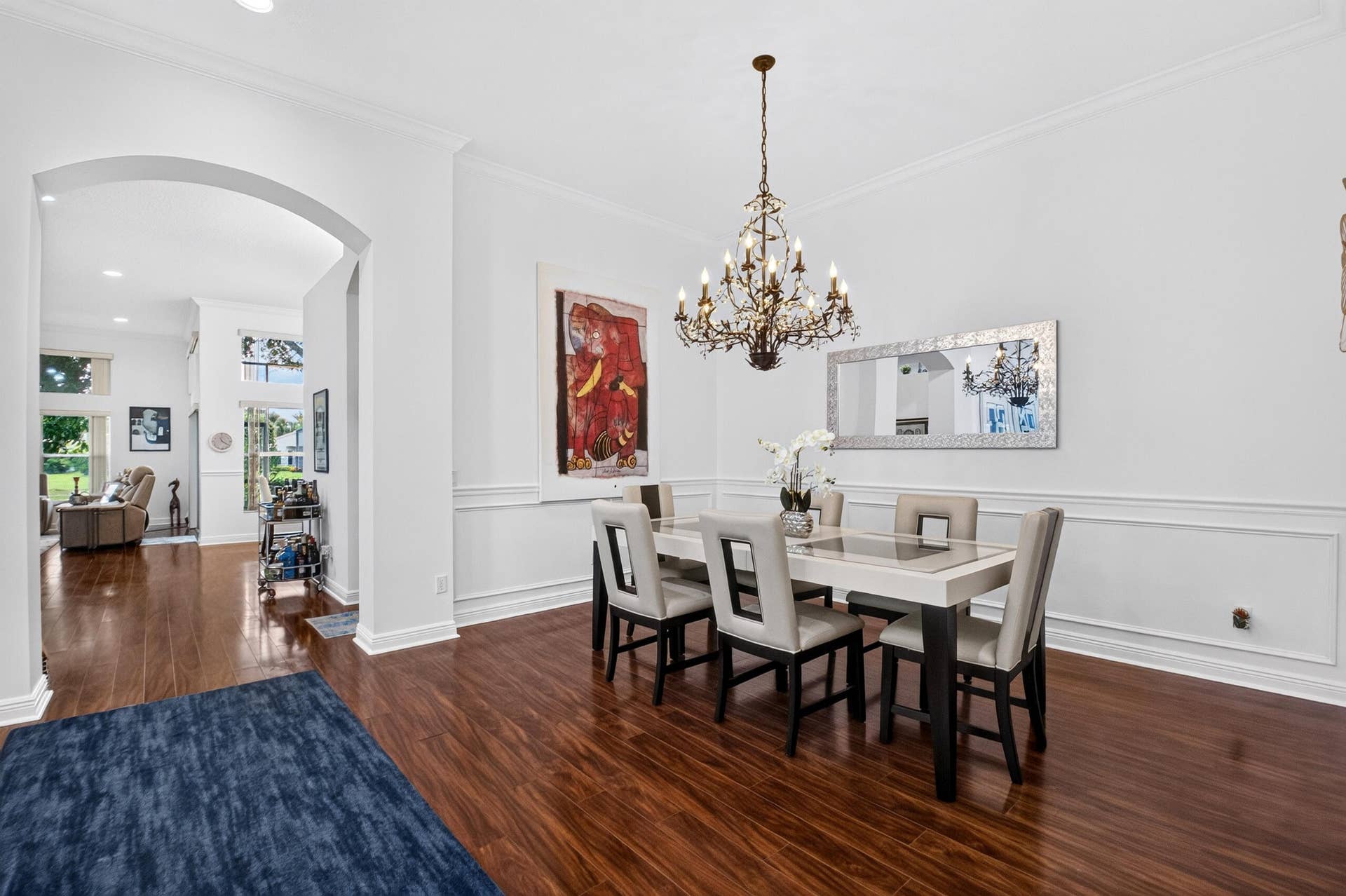 6600 Capistrano Beach Trail, Delray Beach, FL 33446 The Chandelier adds a touch of glamour & sophistication. Custom Molding on the Walls.