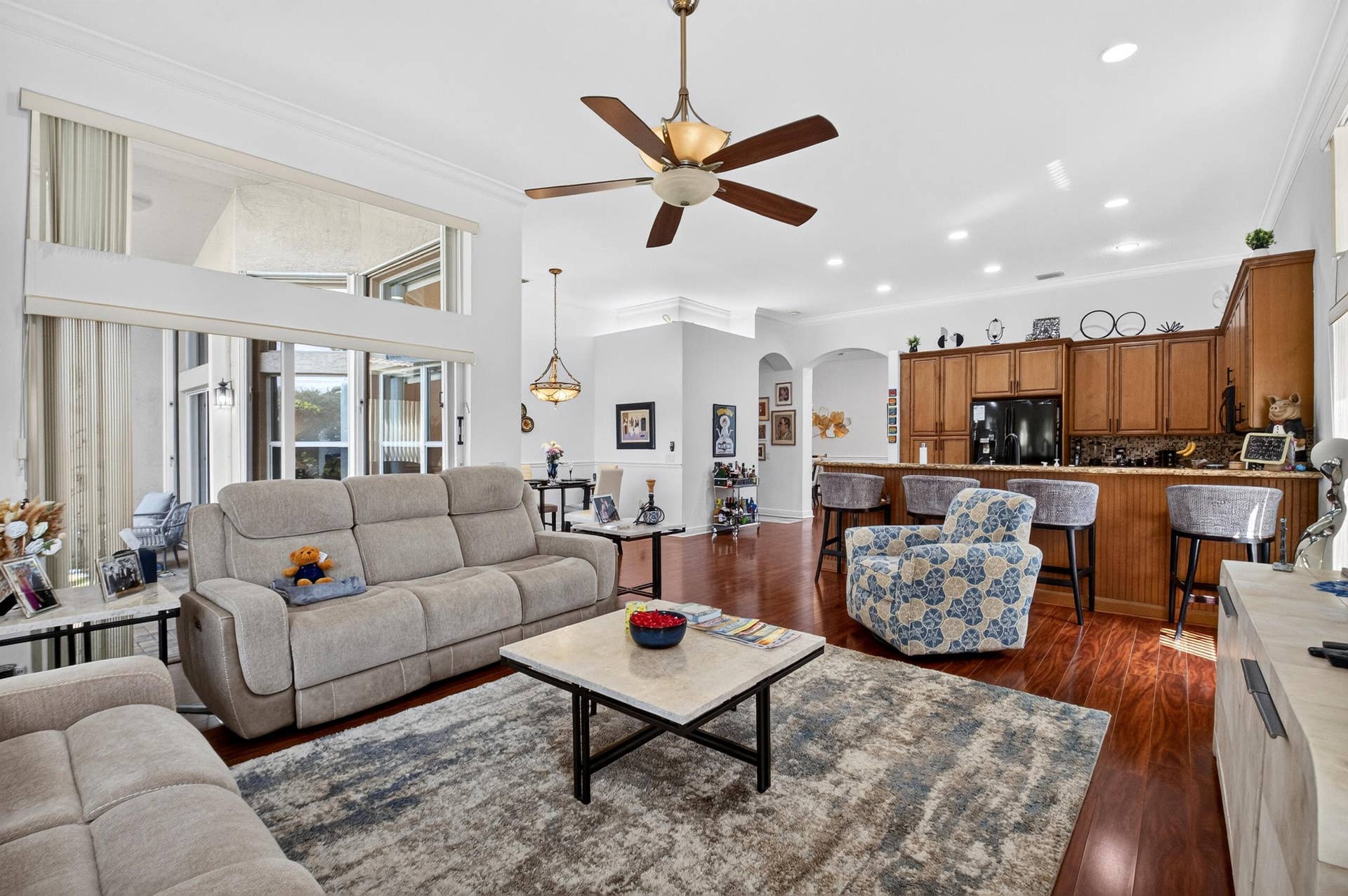 6600 Capistrano Beach Trail, Delray Beach, FL 33446 The flow into the gourmet kitchen & inviting cafe creating an open & airy gathering space for entertaining.