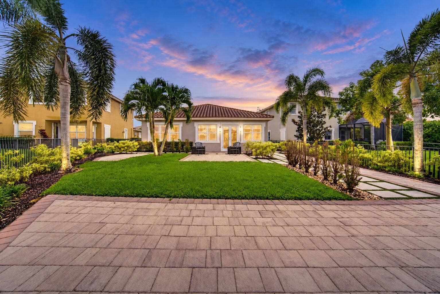8561 LAKESIDE Bend, Parkland, FL 33076 Twilight Palm-Framed Backyard Retreat