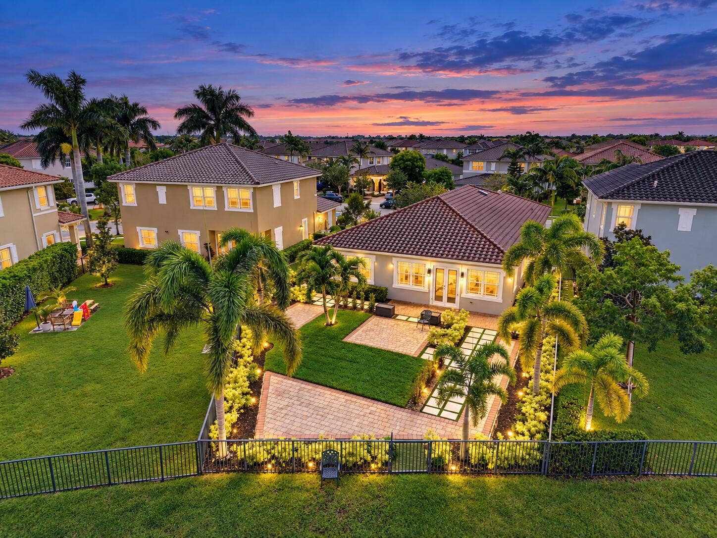 8561 LAKESIDE Bend, Parkland, FL 33076 Twilight Palm-Lined Suburban Backyard
