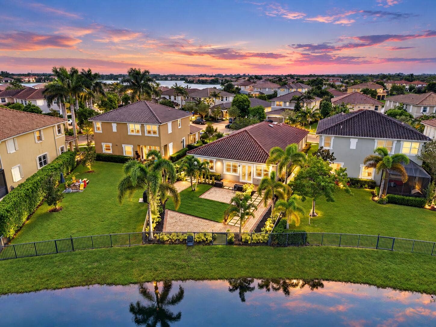 8561 LAKESIDE Bend, Parkland, FL 33076 Twilight Mediterranean Home by the Water