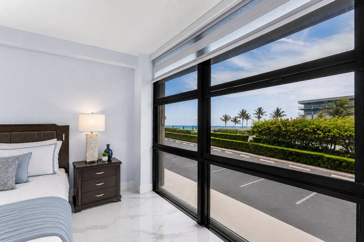 Expansive floor-to-ceiling windows with designer shades and ocean & intracoastal views.