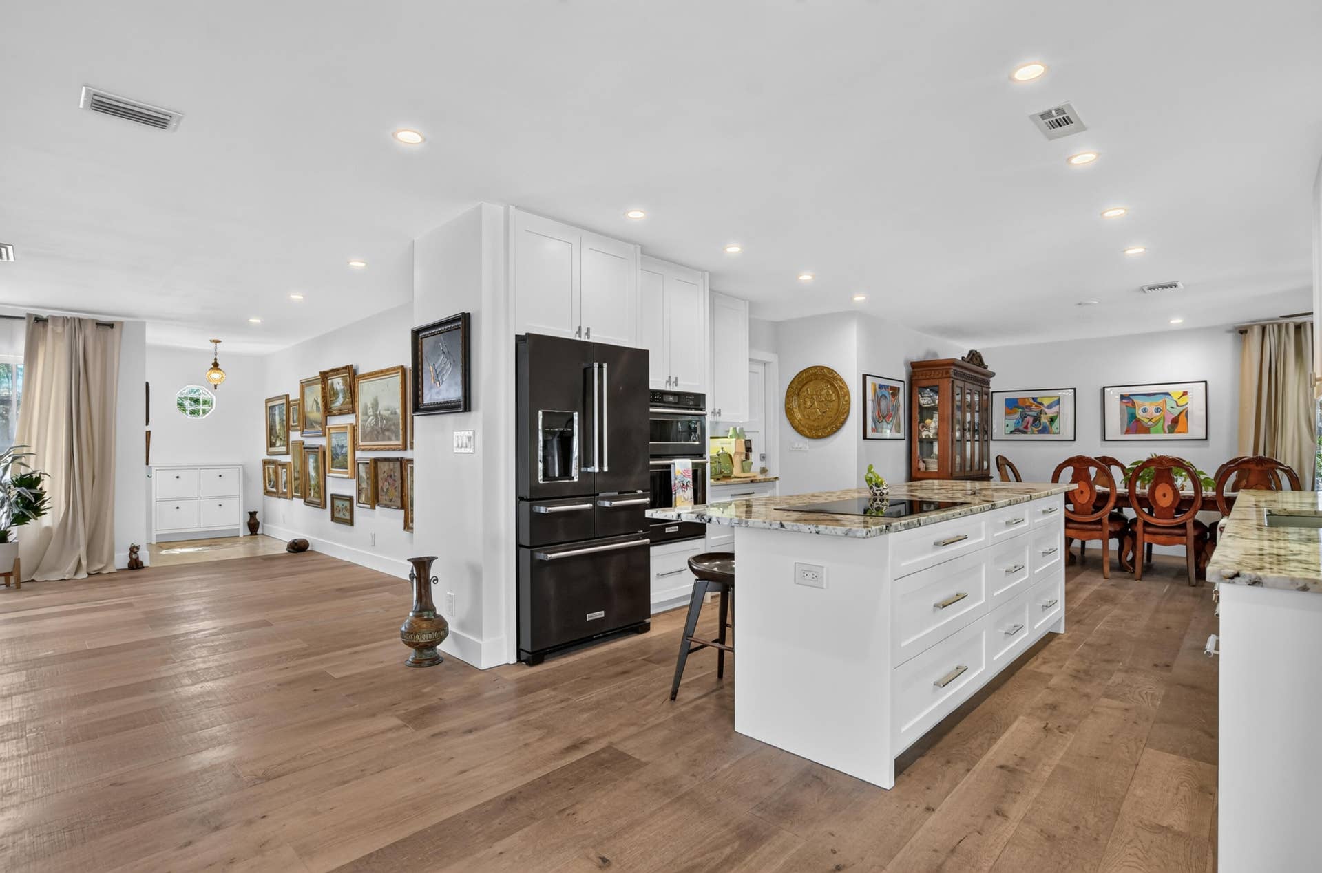 Kitchen featuring Kitchenaide double fridge, wall oven and microwave and induction cooktop.