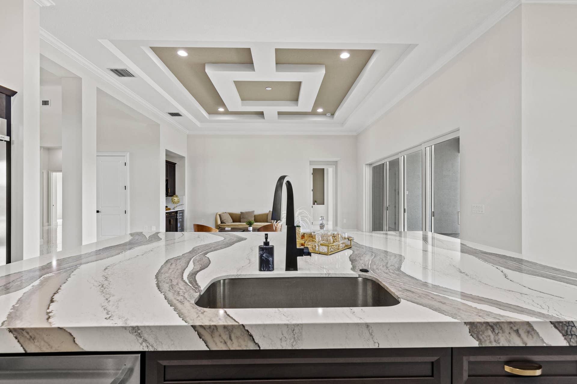 14976 Woodlot Court, Westlake, FL 33470 Expansive kitchen island featuring a deep undermount sink and a matte black gooseneck faucet