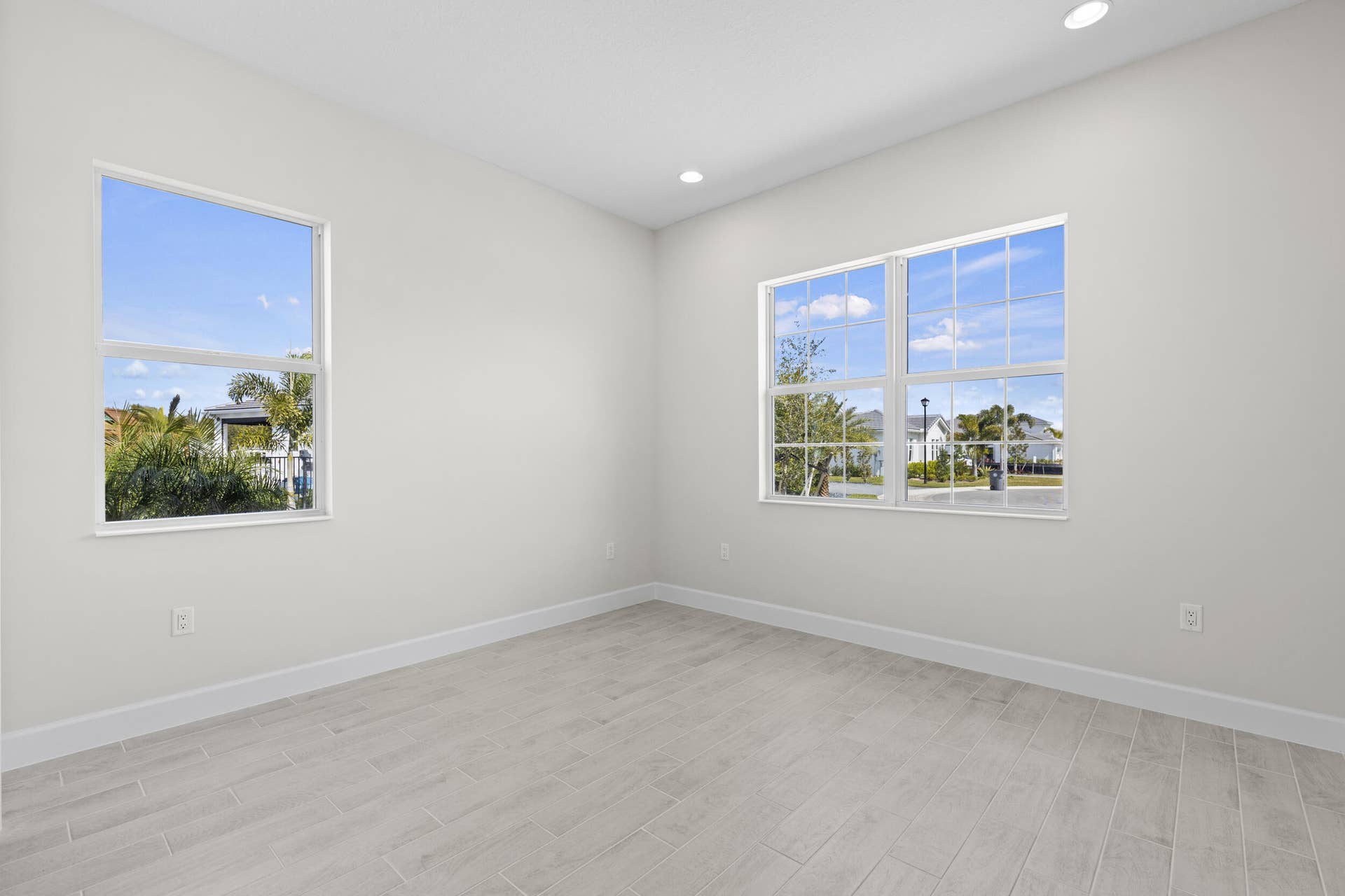 14976 Woodlot Court, Westlake, FL 33470 Bedroom 3 with recessed lighting, light-toned walls, wood-finish flooring, and multiple windows