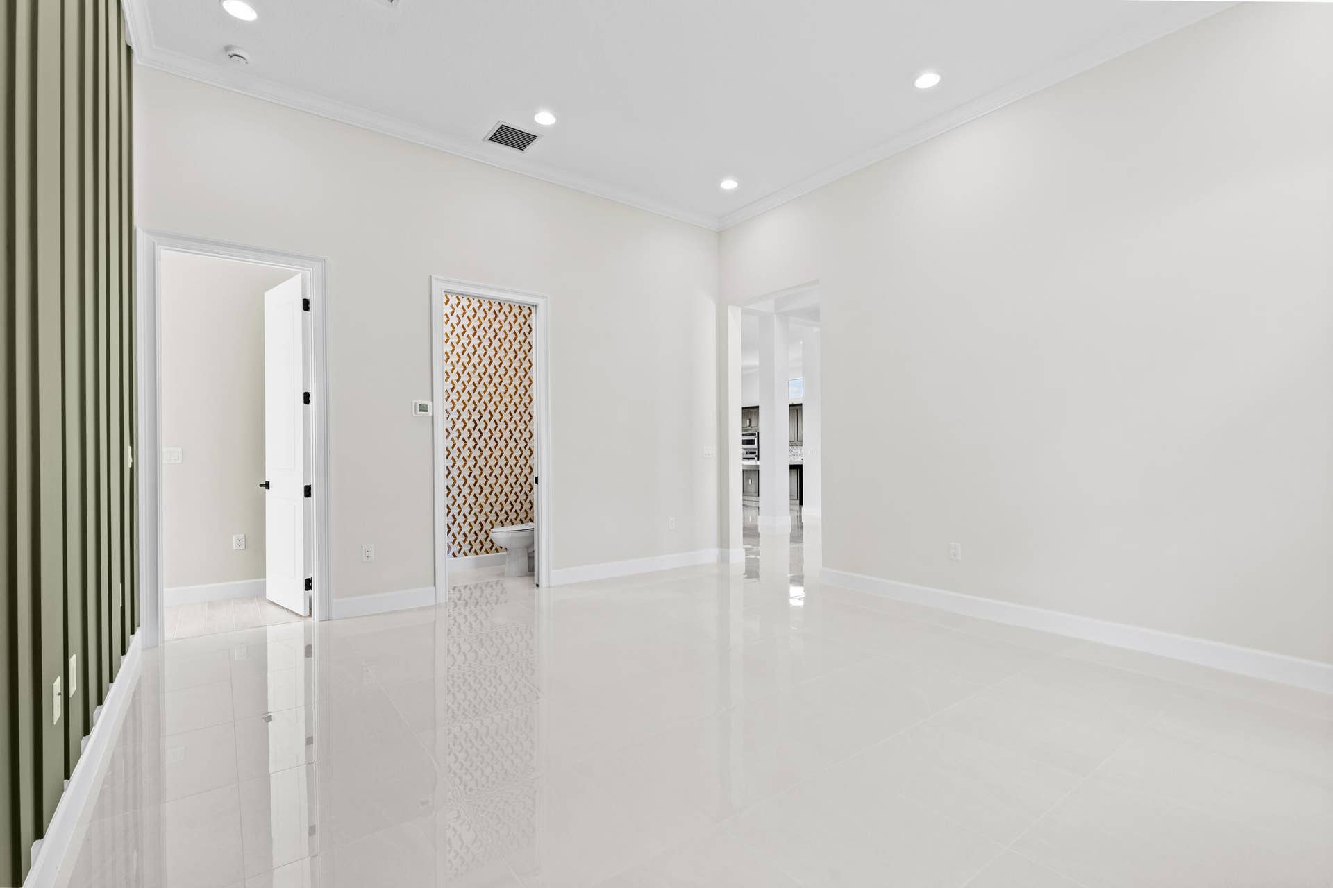 14976 Woodlot Court, Westlake, FL 33470 Flex Room with polished tile flooring, white crown molding, recessed lighting, and a textured accent wall