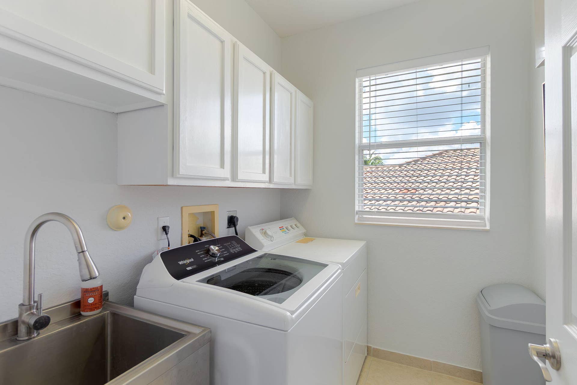Convenient utility sink and new washer in laundry room!
