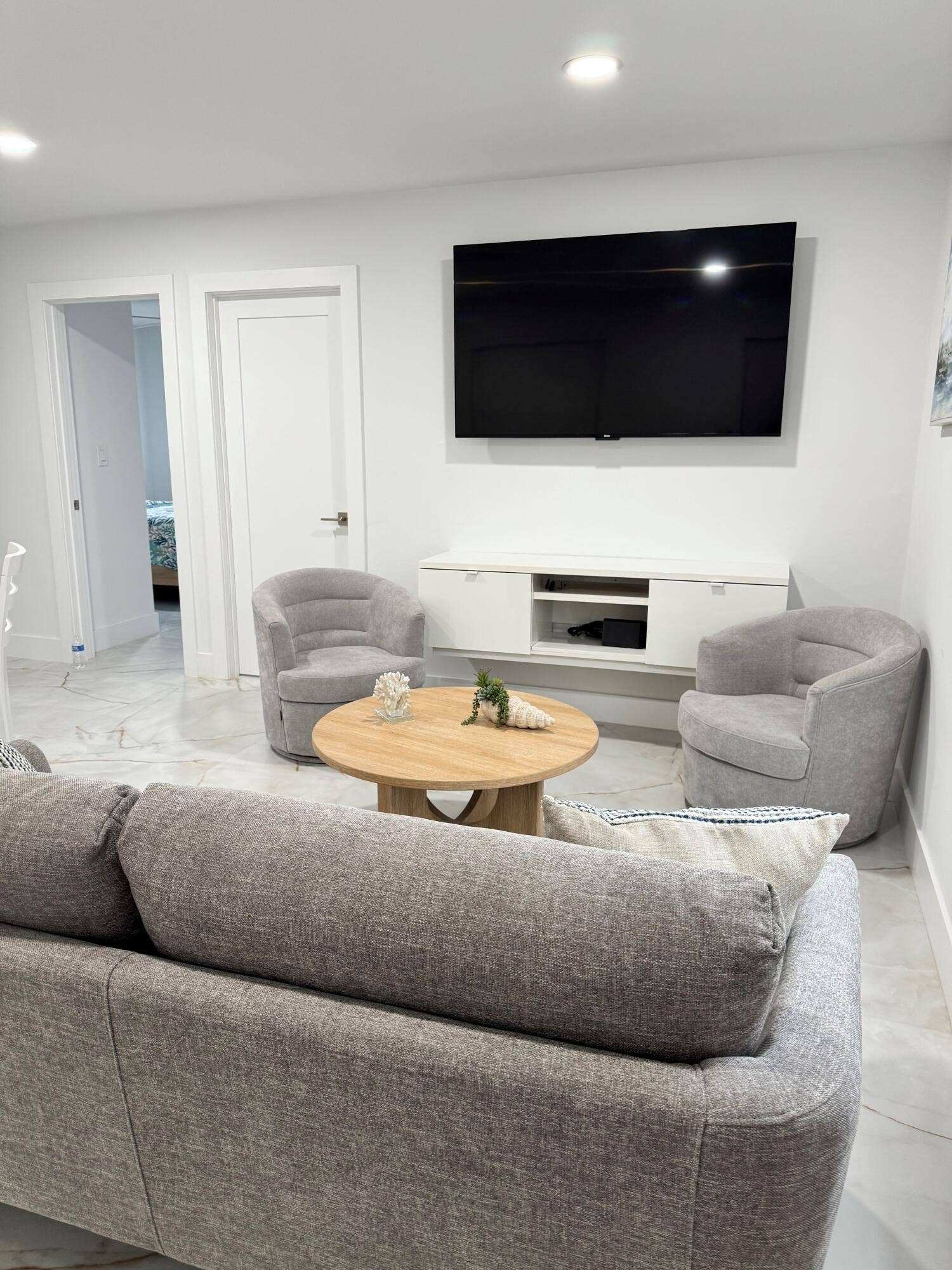 Bright and inviting interior featuring clean white finishes, modern trim, and a neutral color palette