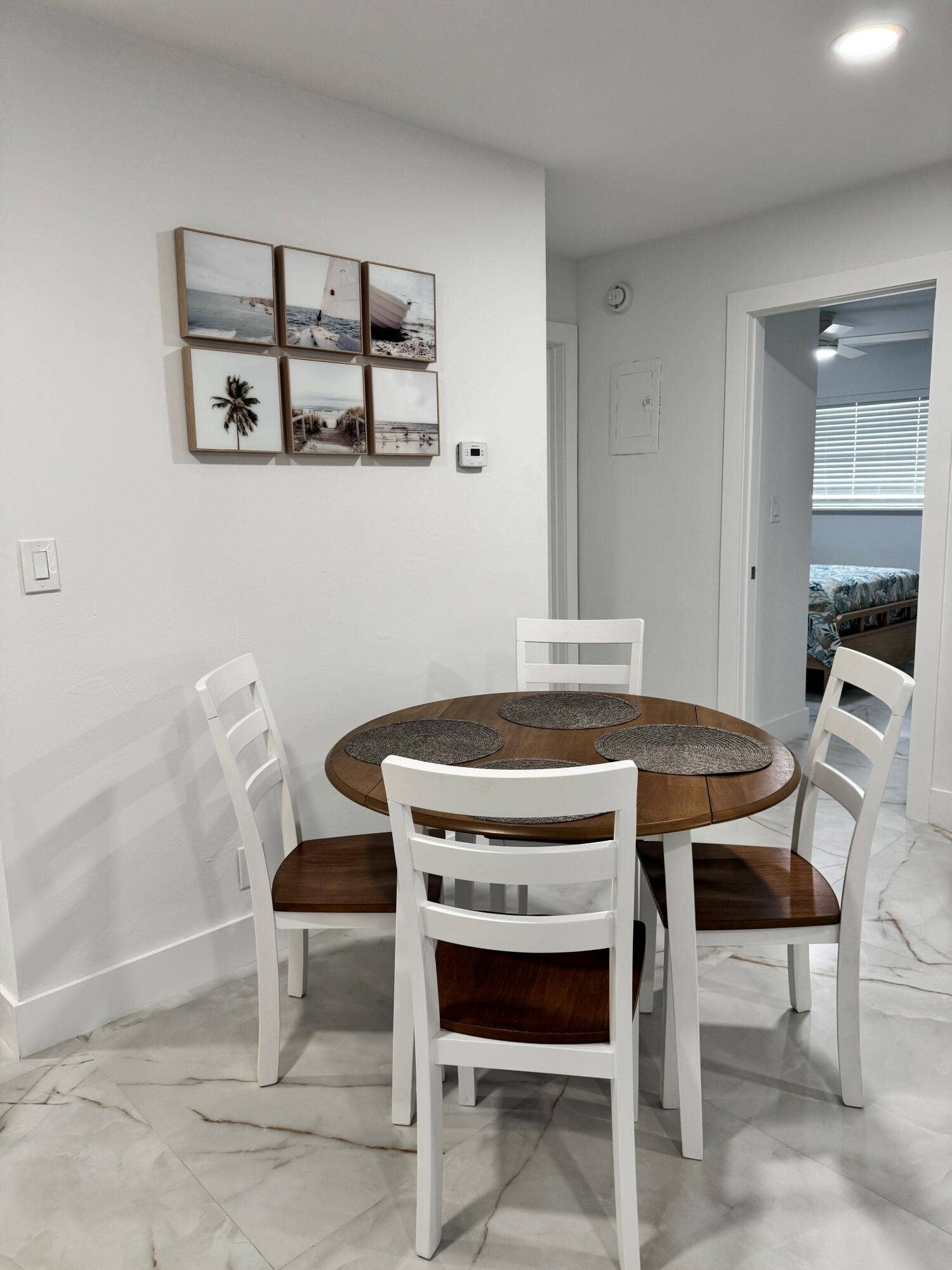 White walls, recessed lighting, and tile flooring
