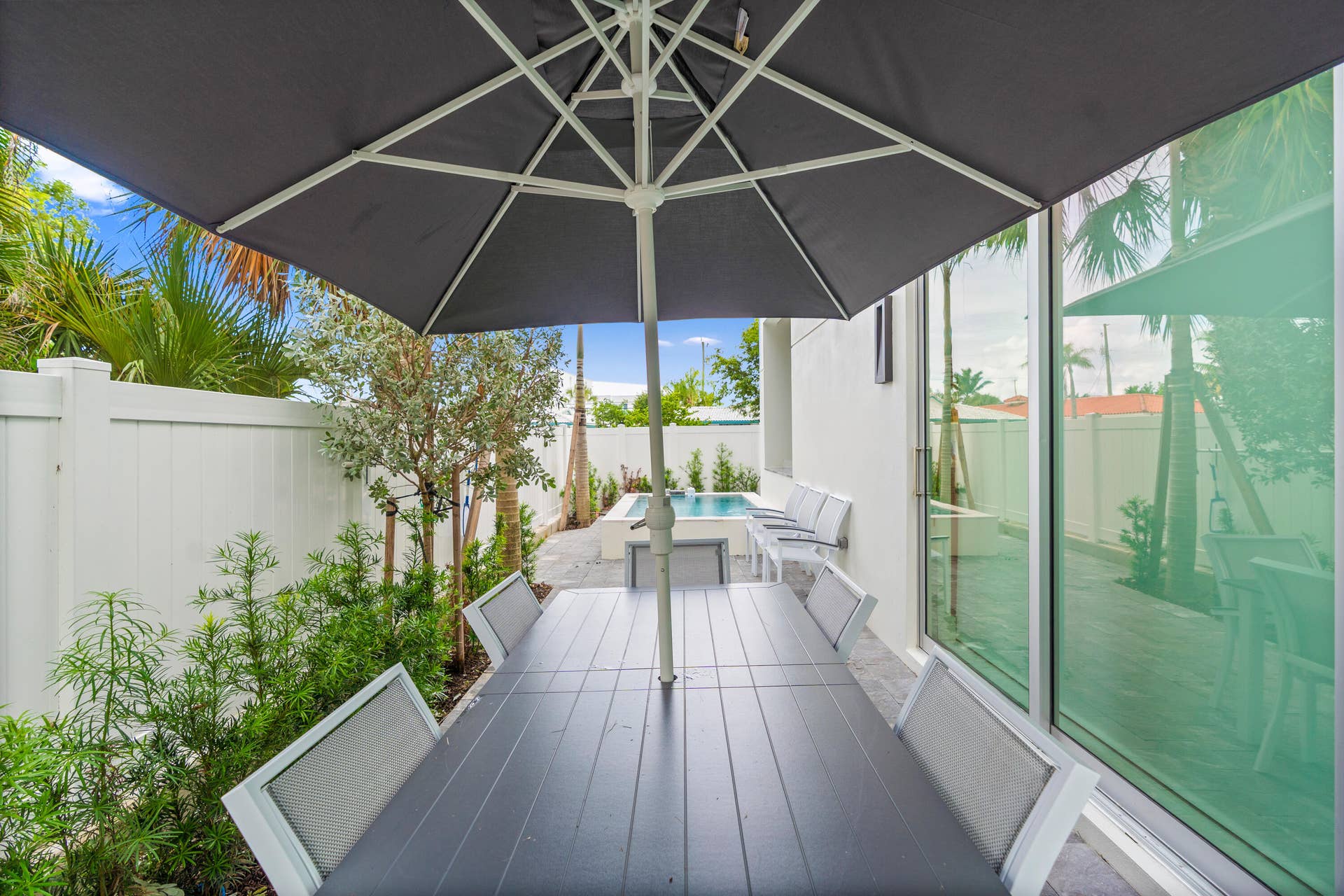 221 Shore Court, Lauderdale By The Sea, FL 33308 221 Shore Ct Patio Area Umbrella - A remarkable luxury townhome rental that redefines upscale living in the heart of Lauderdale By The Sea. This beautifully designed 3,027 sq. ft residence features 4 spacious beds & 4 baths, making it perfect for families or those who love to entertain. The home also offers an outdoor kitchen and BBQ area, along with a private plunge pool that invites relaxation and fun. For boating enthusiasts, a boat slip is also available for rent. Easy access to a plethora of amenities, beach, dining, & entertainment.