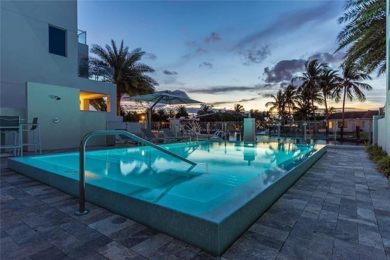 221 Shore Court, Lauderdale By The Sea, FL 33308 Common area pool at dusk