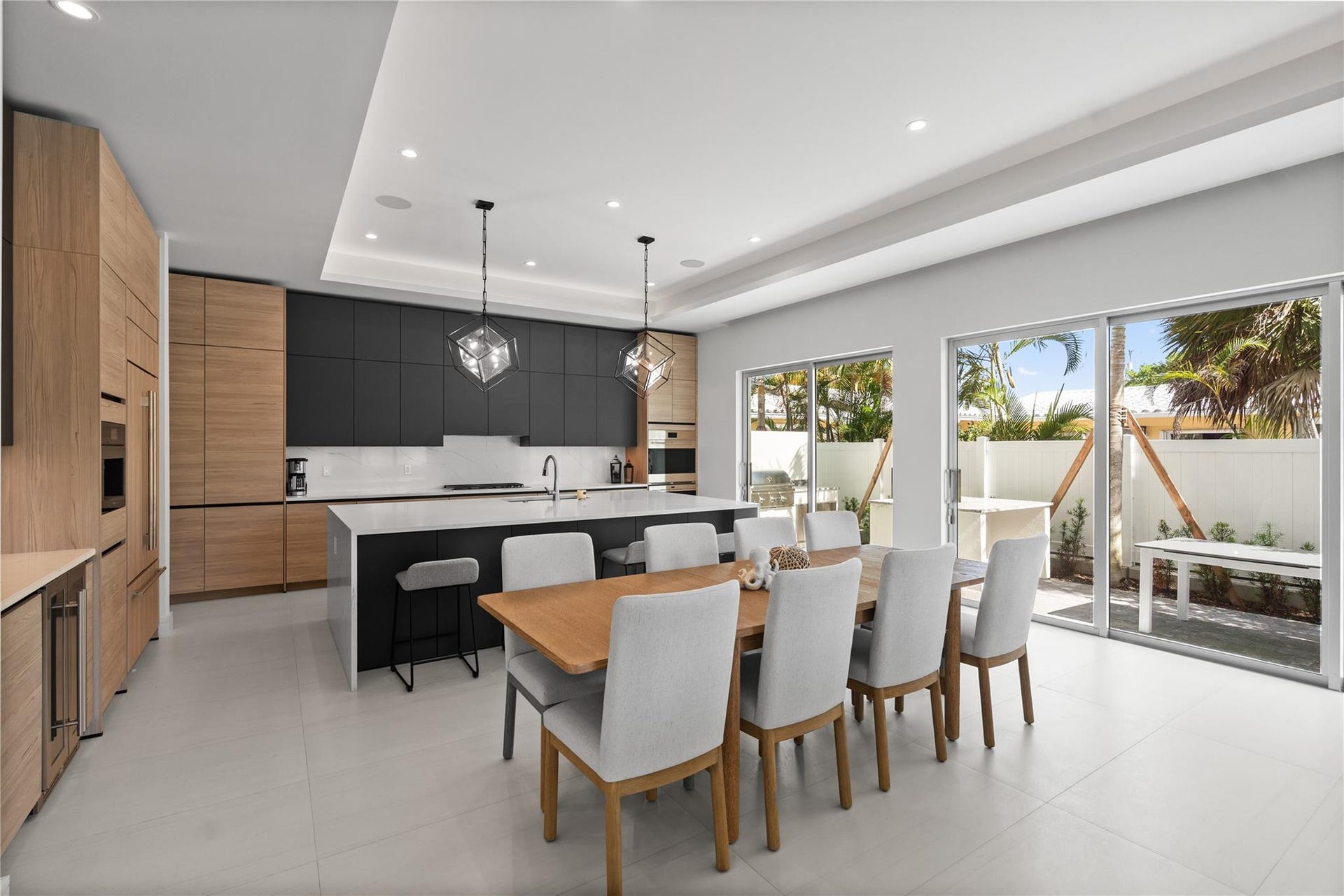 221 Shore Court, Lauderdale By The Sea, FL 33308 A custom designer kitchen with top of the line appliances, huge island, and tons of cabinetry storage. A remarkable luxury townhome rental that redefines upscale living in the heart of Lauderdale By The Sea. This beautifully designed 3,027 sq. ft residence features 4 spacious beds & 4 baths, making it perfect for families or those who love to entertain.The home also offers an outdoor kitchen and BBQ area, along with a private plunge pool that invites relaxation and fun. For boating enthusiasts, a boat slip is also available for rent. Easy access to a plethora of amenities, beach, dining, & entertainment.