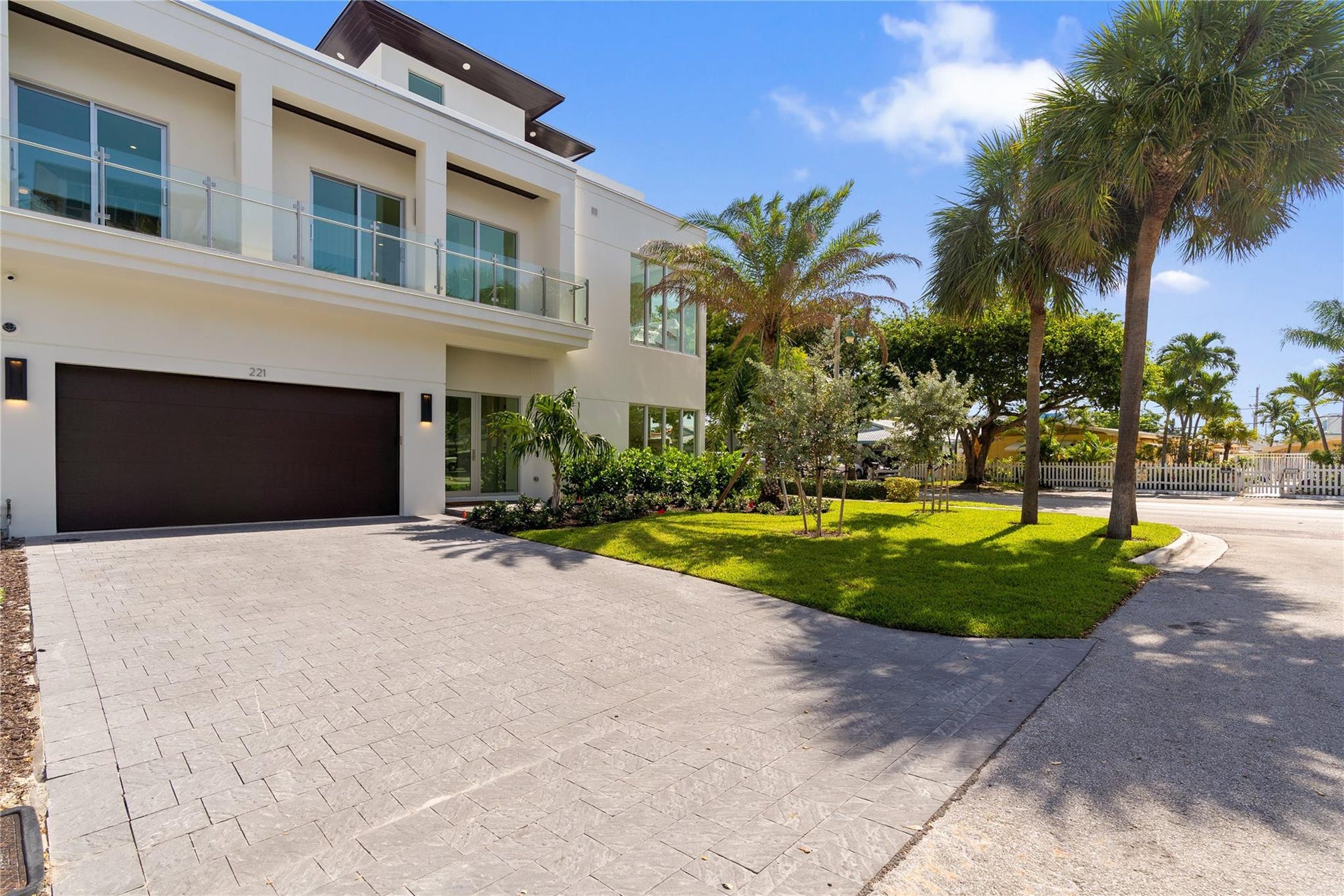 221 Shore Court, Lauderdale By The Sea, FL 33308 Front View - A remarkable luxury townhome rental that redefines upscale living in the heart of Lauderdale By The Sea. This beautifully designed 3,027 sq. ft residence features 4 spacious beds & 4.5 baths, making it perfect for families or those who love to entertain.The home also offers an outdoor kitchen and BBQ area, along with a private plunge pool that invites relaxation and fun. For boating enthusiasts, a boat slip is also available for rent. Easy access to a plethora of amenities, beach, dining, & entertainment.