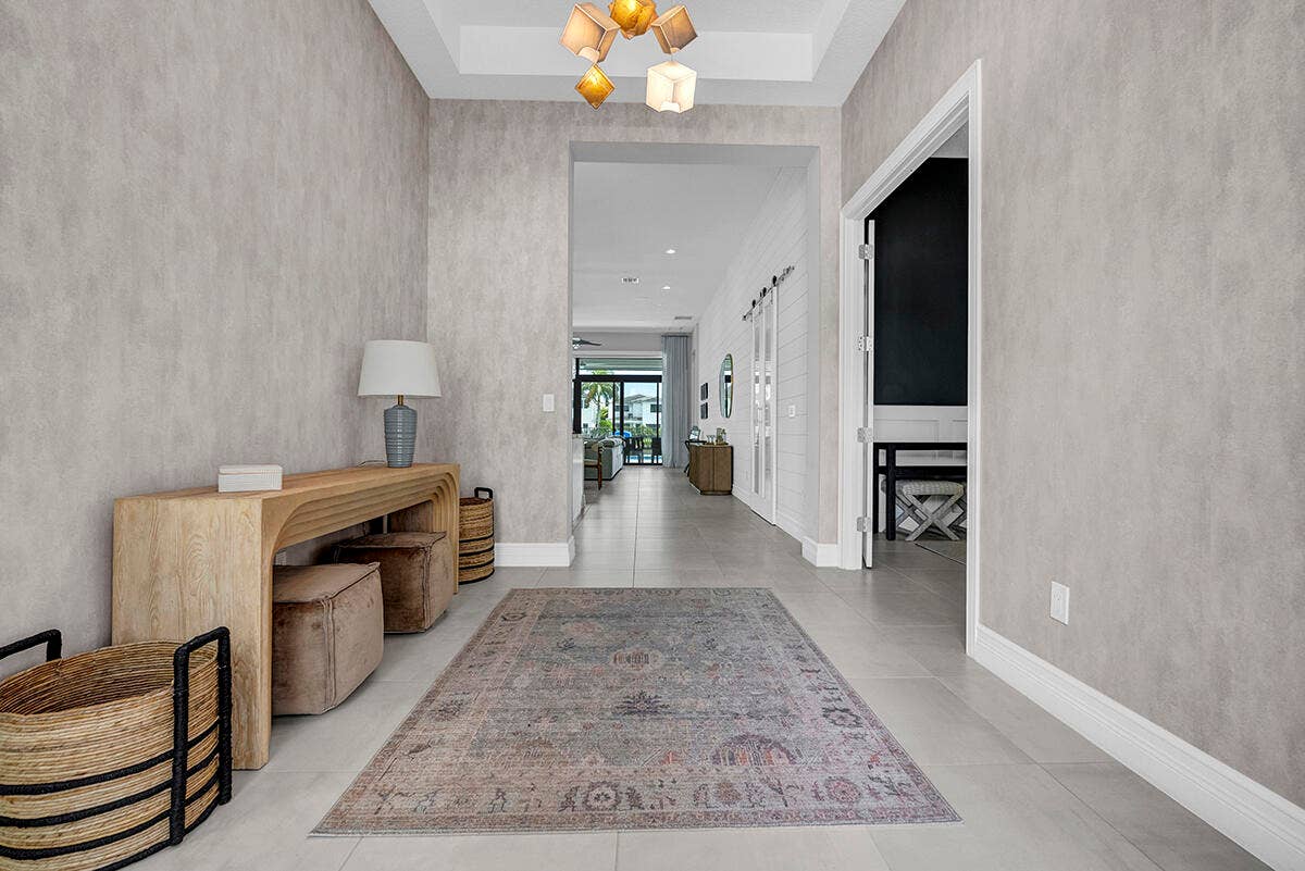 9046 CHAUVET Way, Boca Raton, FL 33496 Spacious entry foyer featuring light-toned walls, tile flooring, and a contemporary ceiling fixture