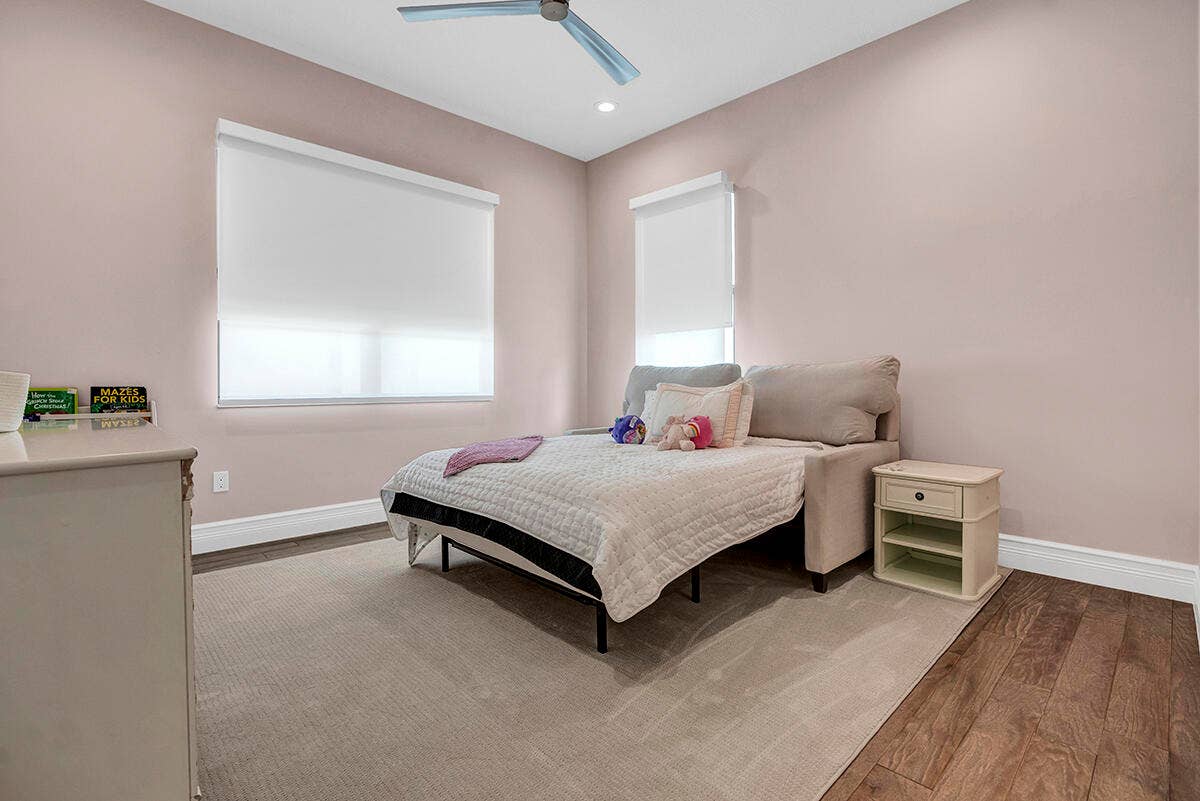 9046 CHAUVET Way, Boca Raton, FL 33496 Recessed lighting illuminates a room featuring a ceiling fan, wood-finish flooring, and white baseboards