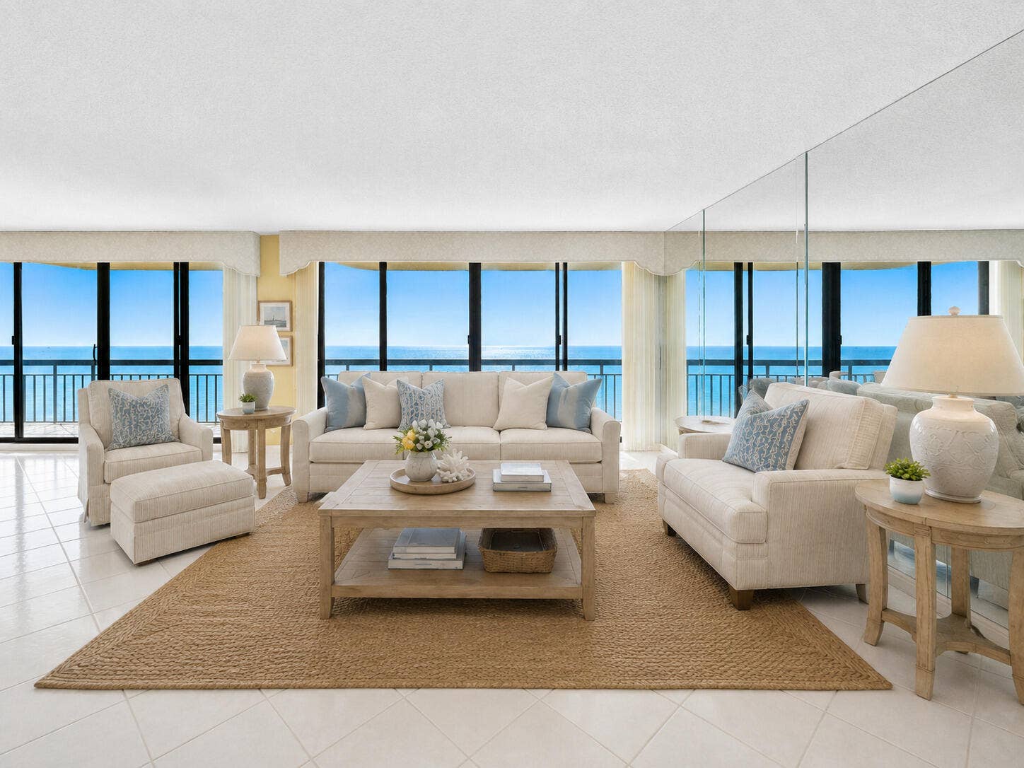 Walls of glass frame direct Atlantic views from the expansive living room. Virtually staged; furnishings and dcor are digitally added and are not included.