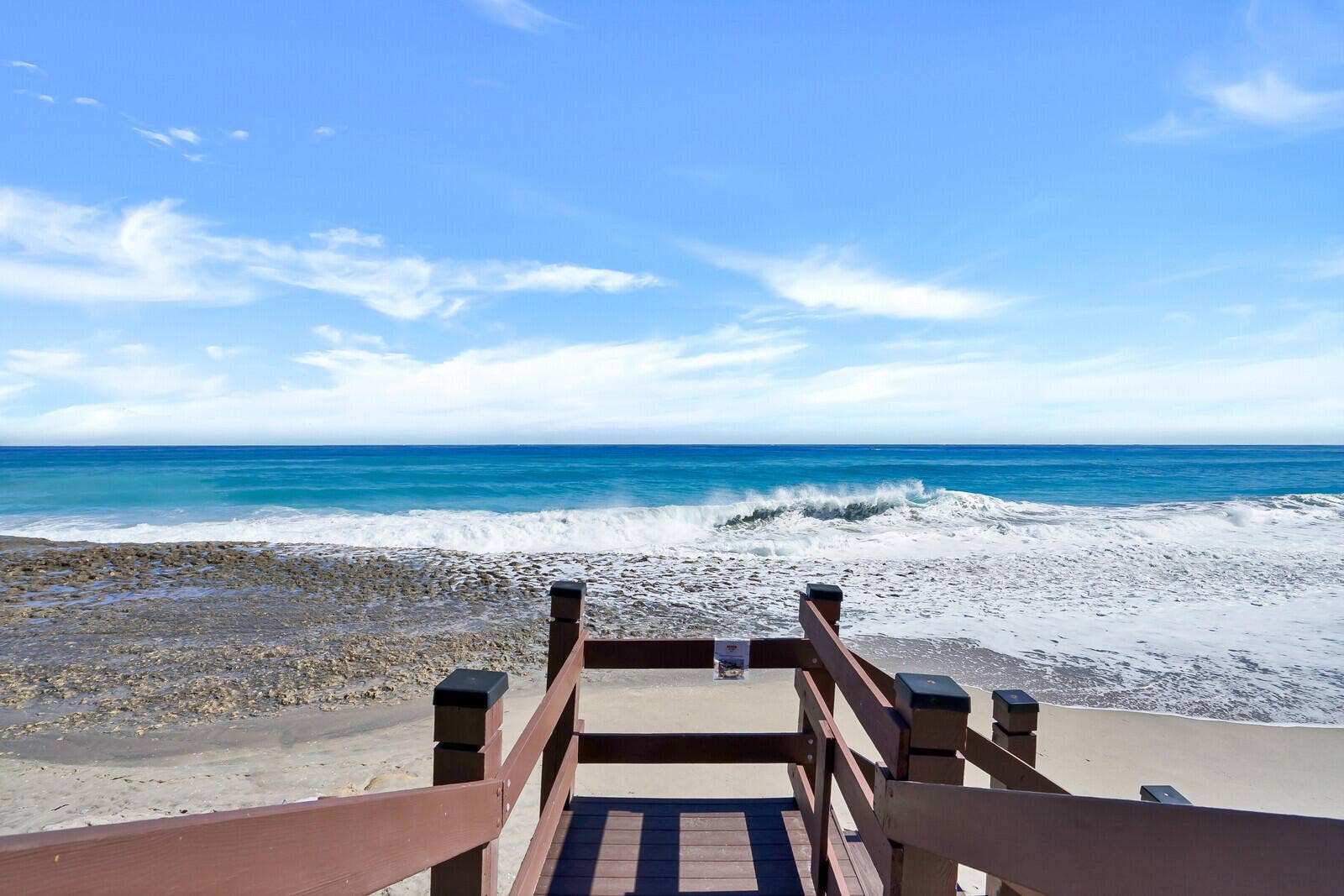 At the end of the boardwalk, the Atlantic shoreline becomes the community's everyday playground.