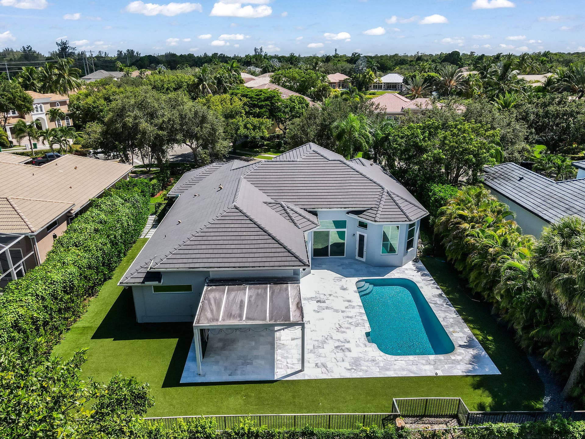 7083 NW 71ST Manor, Parkland, FL 33067 View of manicured yard and pool
