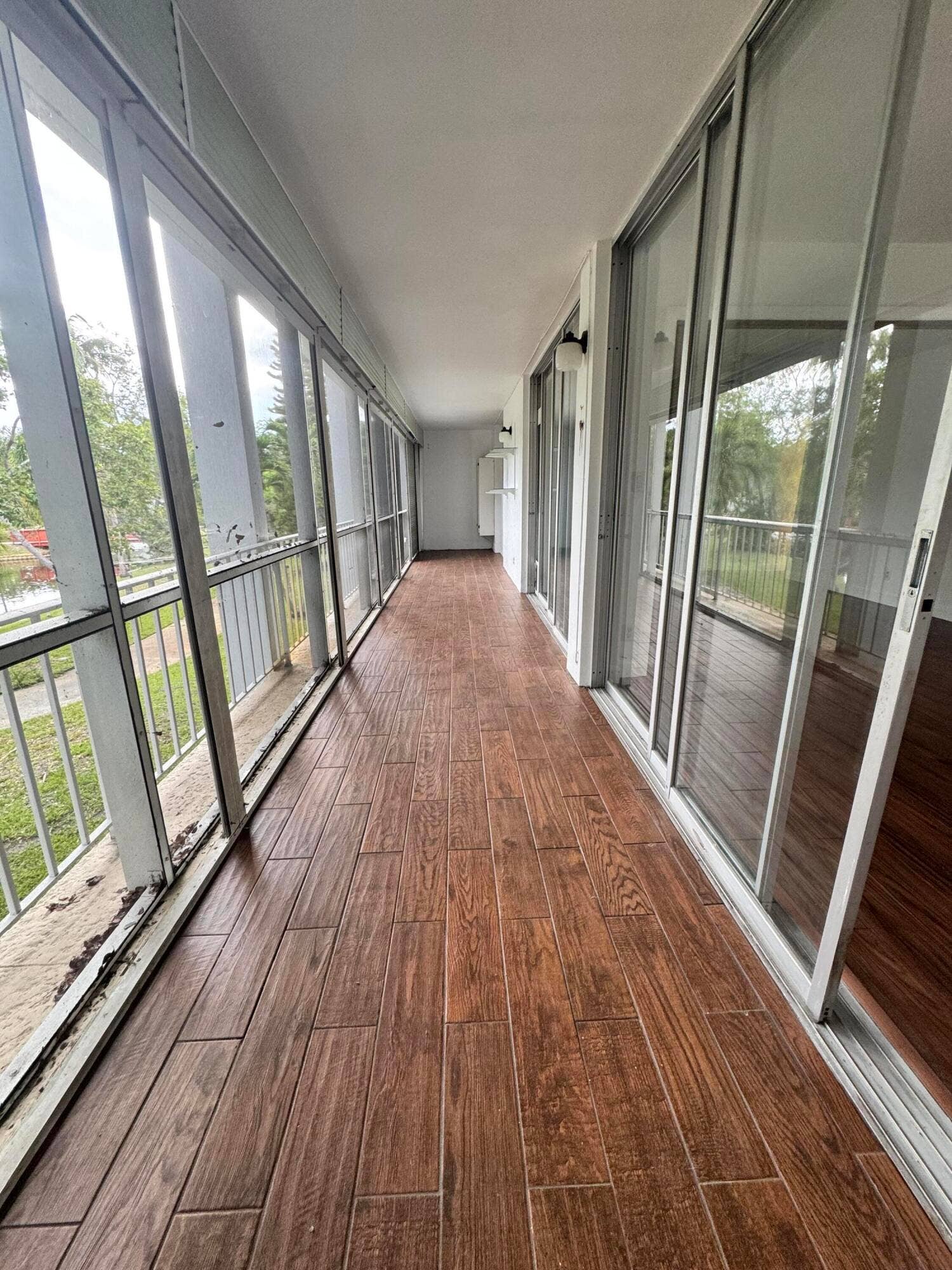 777 SE 2ND Avenue, #213, Deerfield Beach, FL 33441 OVERSIZED TILE PATIO WITH SCREEN OVERLOOKING THE POOL