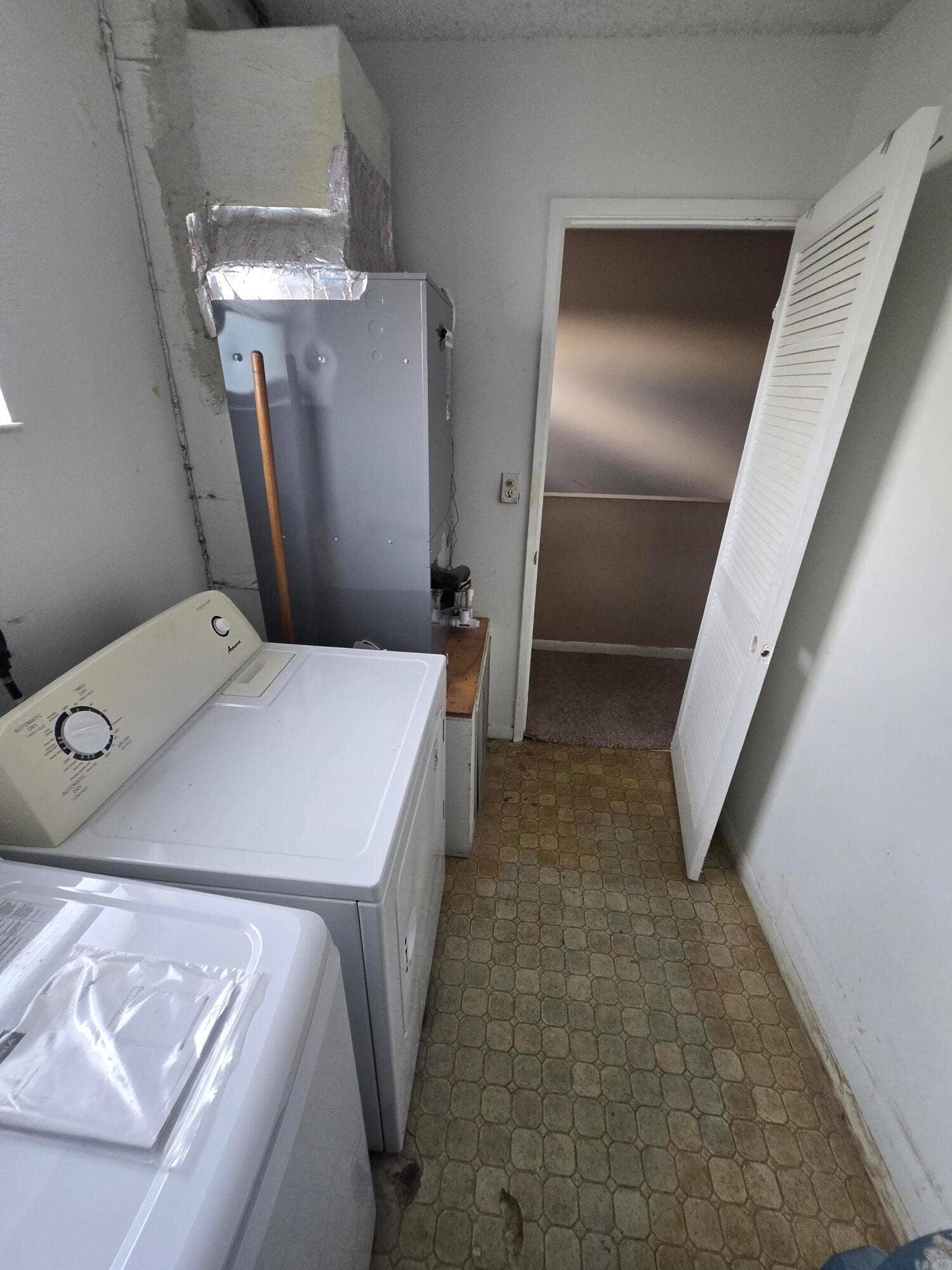 11101 Royal Palm Boulevard, #213, Coral Springs, FL 33065 interior laundry room view