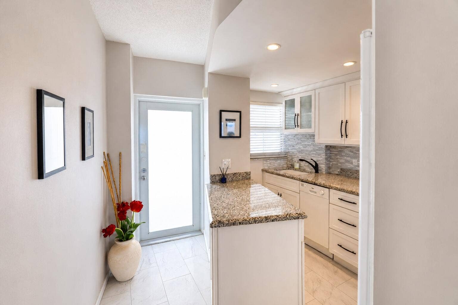 Front door and kitchen.