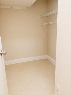 18431 NW 18TH Street, Pembroke Pines, FL 33029 Neutral wall tones, overhead shelving, and tile flooring