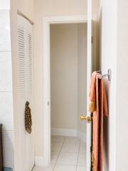 18431 NW 18TH Street, Pembroke Pines, FL 33029 Tile flooring, louvered door, white trim, interior doorway