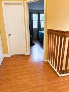 18431 NW 18TH Street, Pembroke Pines, FL 33029 Warm wood-finish flooring throughout, complemented by a natural wood banister