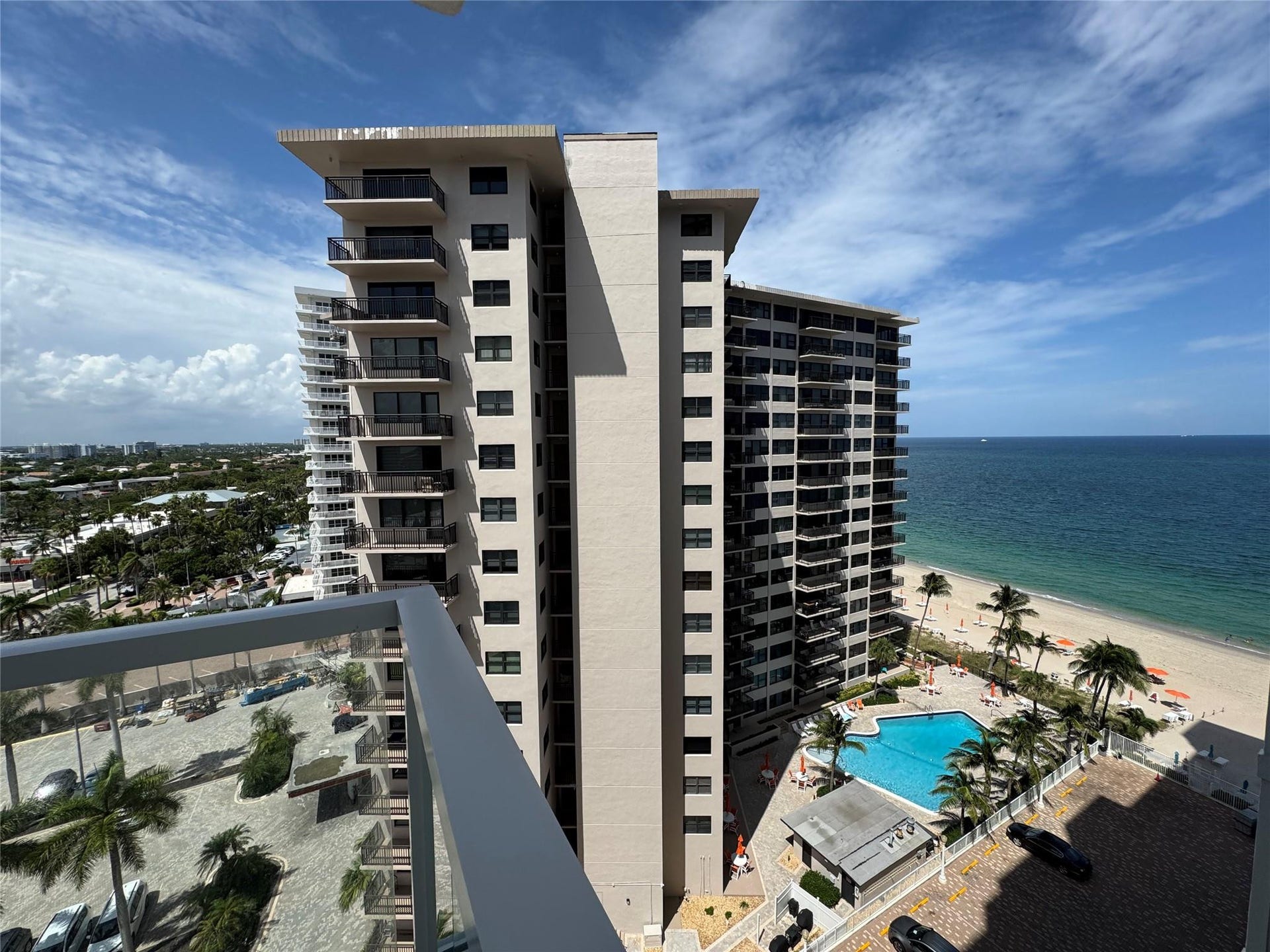 3800 GALT OCEAN Drive, #1508, Fort Lauderdale, Fort Lauderdale, FL 33308 Modern high-rise building featuring multiple balconies, a ground-level swimming pool, and direct beach access