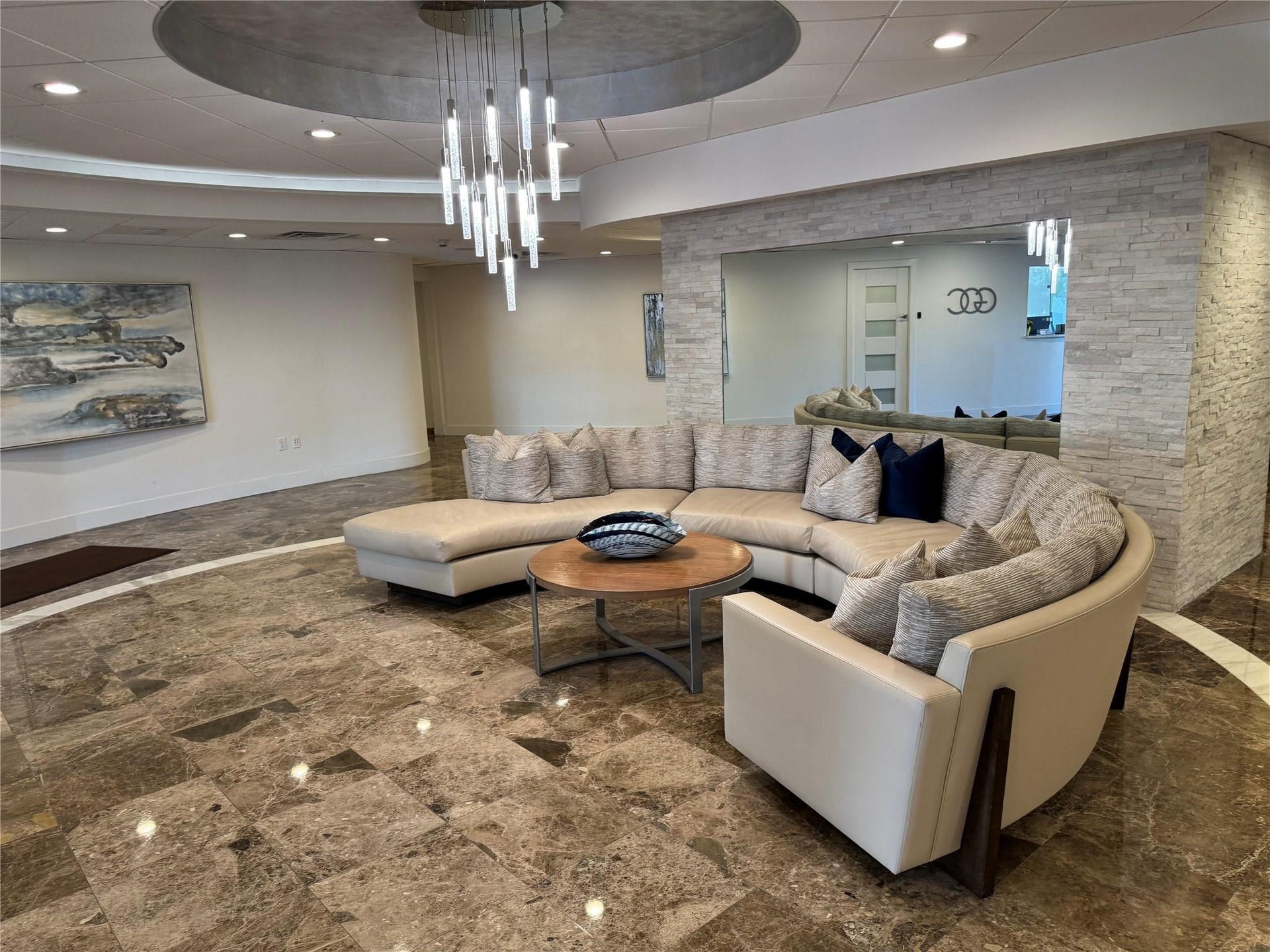 3800 GALT OCEAN Drive, #1508, Fort Lauderdale, Fort Lauderdale, FL 33308 Polished stone flooring with contrasting inlay, elegant chandelier, recessed lighting, and stacked stone wall accents